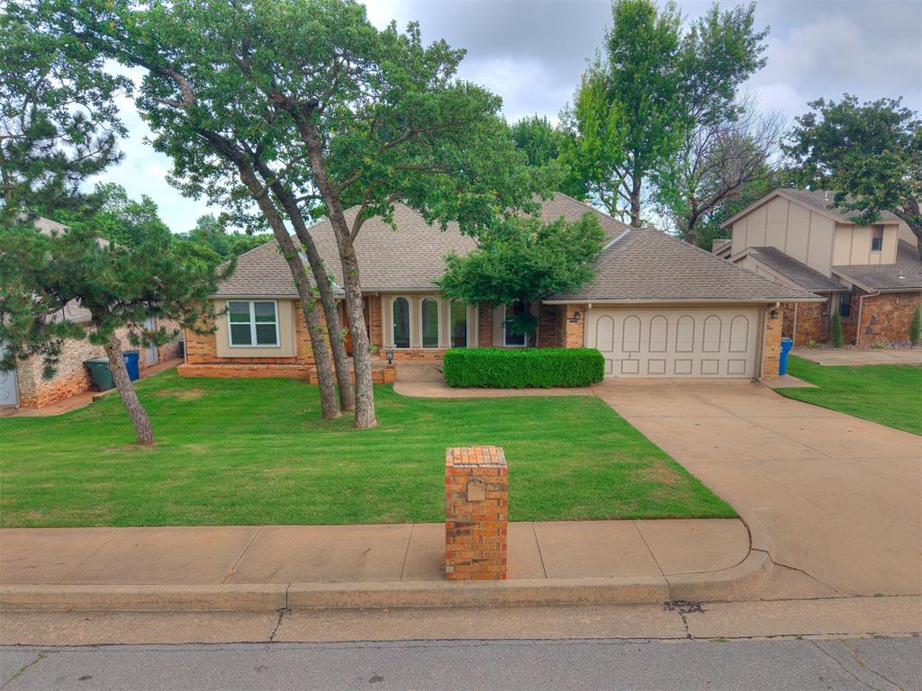 Beautiful, single story, brick home in Edmond’s Kingston Add Amd. This home has 2,485 sf with four bedrooms and 2.5 baths, nice open plan and freshly painted throughout. The living room is huge and features a cathedral ceiling, ceramic tile flooring, and brick fireplace with built-in shelves. Built-ins are stained wood matching the woodwork throughout the house. The living room opens to a sunroom which opens to the wood deck in the backyard. The kitchen features ceramic tile floors, stainless steel appliances and new granite countertops with undermounted sink and new faucet. The formal dining room features crown molding, a chandelier, and ceramic tile flooring. The spacious primary bedroom suite features a trey ceiling, crown molding and ceramic tile floors. The private bath shares the tub but features separate vanities on opposite ends with separate doors from the bedroom. Also, it has separate walk-in closets with entry from each vanity. Bedroom 2 features ceramic tile floors and it own private bath with a shower, ceramic tile floor and new granite countertop, sink and faucet. Bedrooms 3 & 4 have ceramic tile flooring and share a Jack & Jill bath with a walk-in closet and separate vanities which also have new granite countertops, sinks, and faucets. The spacious utility room has gas and electric dryer hookups, ceramic tile flooring and lots of cabinet space. The attached double car garage has remote opener for the garage door. You can step out the back door to a large wooden deck overlooking the privacy fenced backyard to relax and enjoy nature. There are nice mature trees in both backyard and front yard.