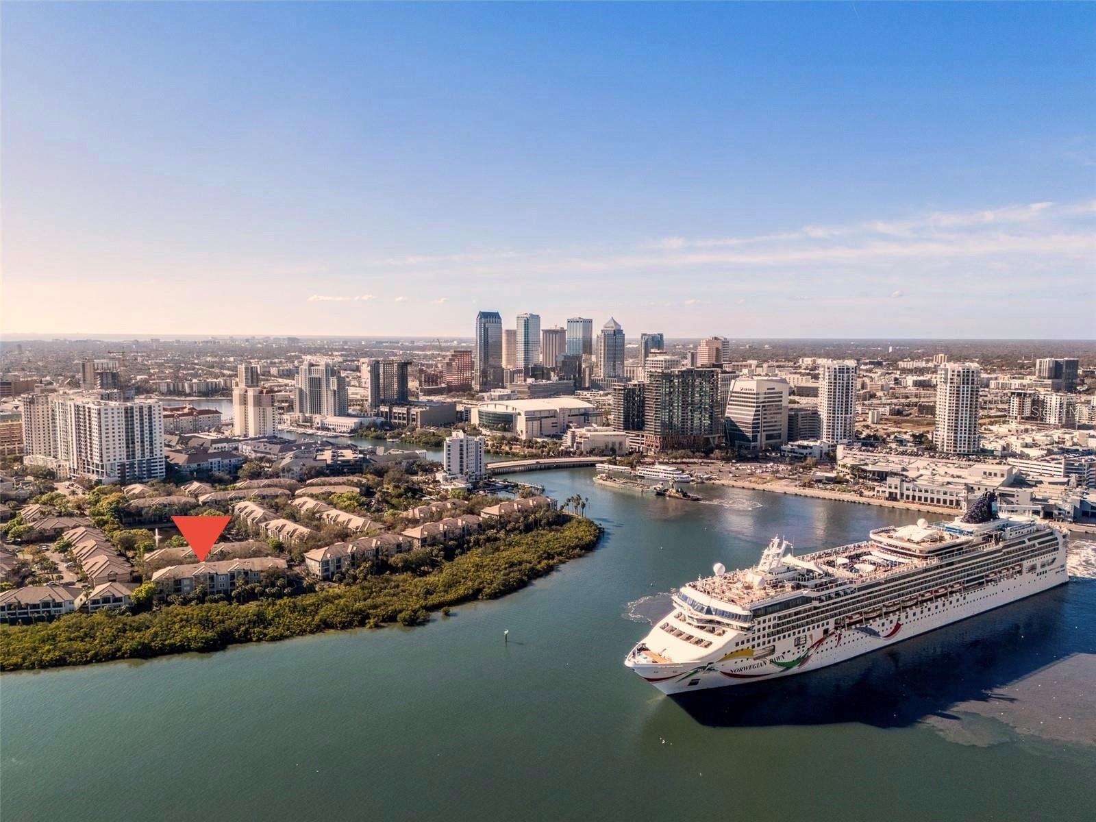 Welcome to Island Place Private Residences on prestigious Harbour Island, where waterfront living offers privacy, convenience, and resort-style amenities within a 24/7 guard-gated community. Ideally located near Downtown Tampa, this beautifully renovated townhome-style condo is just moments from Water Street, Sparkman Wharf, the Tampa Riverwalk, Armature Works, the Channel District, Ybor City, the Tampa Convention Center, and the exciting Lightning Hockey games and concerts at the BIA Arena. Residents enjoy convenient access to fine dining and a pedestrian-friendly Tampa lifestyle, complete with a lively entertainment district.This exceptional 2-bedroom, 2-bath residence offers 1,225 square feet of thoughtfully designed living space across three levels, with no upstairs neighbors for added privacy and comfort. The home features a private attached 2-car walk-up garage plus 2 driveway parking spaces for a total of 4 vehicles.The open layout is filled with natural light and features high ceilings and premium finishes throughout, including 48-inch porcelain plank flooring, crown molding, recessed lighting with dimmers, designer lighting, high-impact windows and sliding doors, stainless-steel railings and handrails, remote-controlled shades, plantation shutters, an interior water shut-off valve, a Nest thermostat, and overhead and shelf storage in the garage.The stylish kitchen combines beauty and functionality, featuring 42-inch stacked cabinetry, unique leathered granite countertops and backsplash, stainless-steel appliances, a wine refrigerator, a walk-in pantry, and a stainless-steel apron sink. Double sliding glass doors open to a private balcony overlooking the Garrison Channel, where cruise ships and other watercraft create a stunning waterfront backdrop.The spacious primary suite features dual closets and an elegant bath with a walk-in shower. The generously sized secondary bedroom includes a walk-in closet and access to a beautiful guest bath with a soaking tub. The washer and dryer are located in the hallway, concealed behind double doors. Residents enjoy resort-style amenities, including a temperature-controlled sparkling pool and heated spa, tennis courts, a fitness center, a playground, BBQ areas, two clubhouses, waterfront walking paths, pet-friendly areas, and a car wash station.Experience the finest aspects of living on Harbour Island—it's private, elegant, and truly one of a kind.