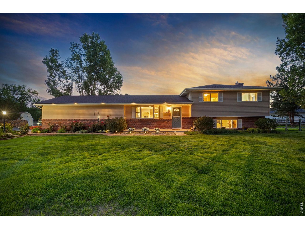 A rare opportunity to enjoy the space and freedom of country living without giving up the convenience of being close to town! This home, pre-inspected for your peace of mind was originally built as the developer's own private residence. Sitting on a full acre just 13 minutes from Old Town and 5 minutes from I-25. Inside, the 3-bedroom, 3-bath home blends character with beautiful modern updates. At the heart of the home is the recently remodeled kitchen, featuring gorgeous quartz countertops, a commercial range, beautiful wood flooring, real maple and oak cabinets, and a dedicated beverage station complete with a wine fridge and second sink. The spacious primary bedroom includes its own ensuite bath.There are two living spaces and downstairs there is a real wood burning fireplace. An oversized attached two-car garage provides plenty of room for vehicles, storage, and projects, but the possibilities extend far beyond the main house. The impressive 26x40 shop features a central air distribution system and offers exceptional space for hobbies, equipment, a workshop, or home-based projects. Above the shop is an approximately 800 sq ft studio, perfect for an additional bedroom, office, creative studio, rec area, or whatever fits your lifestyle.Come for the carefully curated interior but stay for the impeccably maintained property. Raised garden beds are ready for your next growing season, while the chicken coop-equipped with water and electricity-makes backyard chickens easy. A loafing shed and 10x12 storage shed add even more functionality. There's plenty of room for RV parking, trailers, toys, and equipment. Enjoy the convenience of city water for the home while utilizing the property's well to help keep the grounds, gardens, and landscaping lush and green. Practical neighborhood covenants offer a refreshing balance, helping maintain a well-cared-for community while still giving homeowners plenty of autonomy to use and enjoy their property.