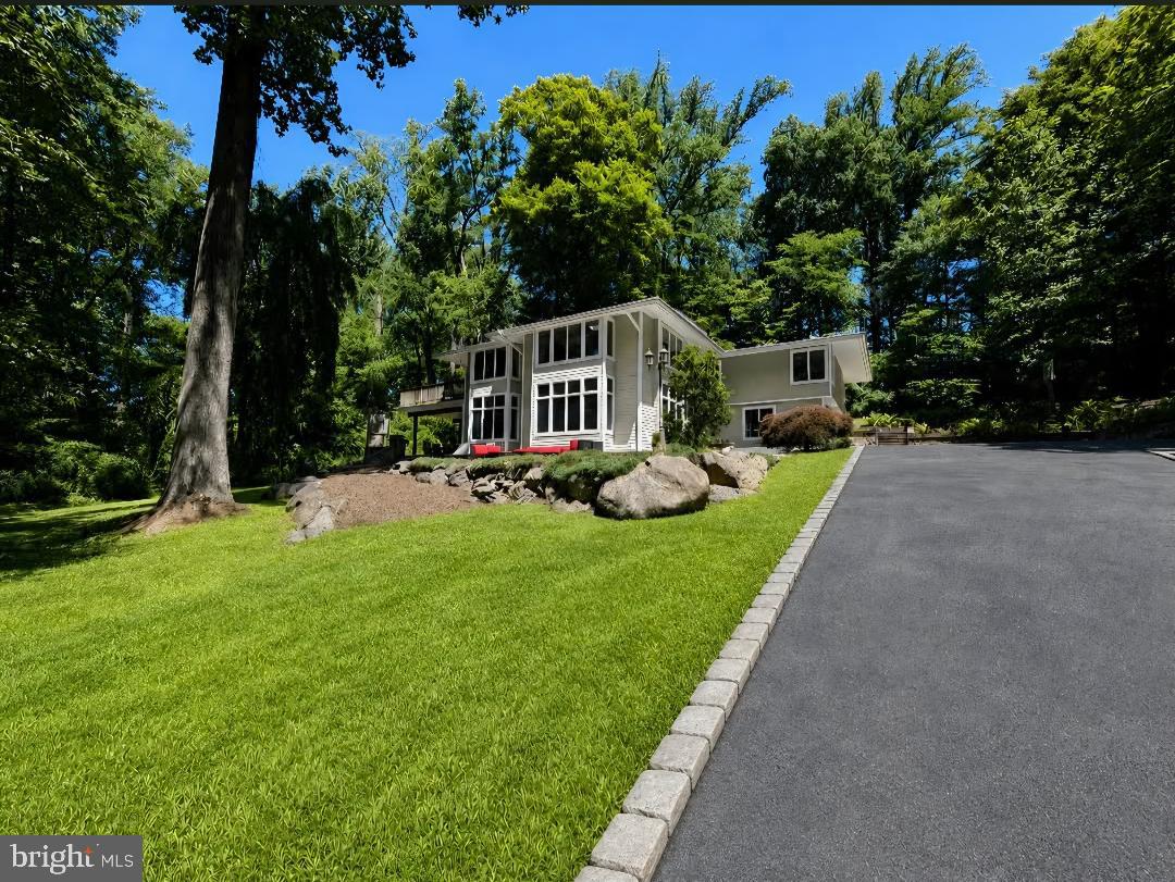 Exceptional opportunity to own a spacious and beautifully situated home in the highly sought after Radnor Township School District. Nestled on a wooded, private cul-de-sac in the heart of Villanova.  This impressive residence offers approximately 5,400 square feet of living space, thoughtfully designed for both everyday living and entertaining.Set on one of the most desirable lots in the township, the property provides an expansive layout and includes generous living and dining areas, large kitchen with island seating and sitting room with fireplace.  Off the kitchen you will find an outdoor covered area for relaxing with the family or entertaining guests by the fireplace. The large laundry room is on the lower level with cabinetry and utility sink.  The generous mud room with cabinetry and utility sink has an entrance from garage.  The upper level has 4 bedrooms and a spacious bonus room with built in cabinetry suitable for a possible 5th bedroom, or office space.  In addition, this home provides a rare second level living space, with an immense area for an additional family room, media room or entertainment center.  The Master bedroom and second bedroom have sliders to a shared deck space for a tranquil retreat.  The partial basement is furnished with select gym equipment being sold with the home.  With a central vacuum system and 3 and 1 half baths, this home is sure to satisfy all your needs for comfortable living and entertaining.OPEN HOUSE SUNDAY JULY 19, 12 TO 3PM**  ALL OFFERS WILL BE PRESENTED TO SELLERS BY 5PM MONDAY, JULY 20 **