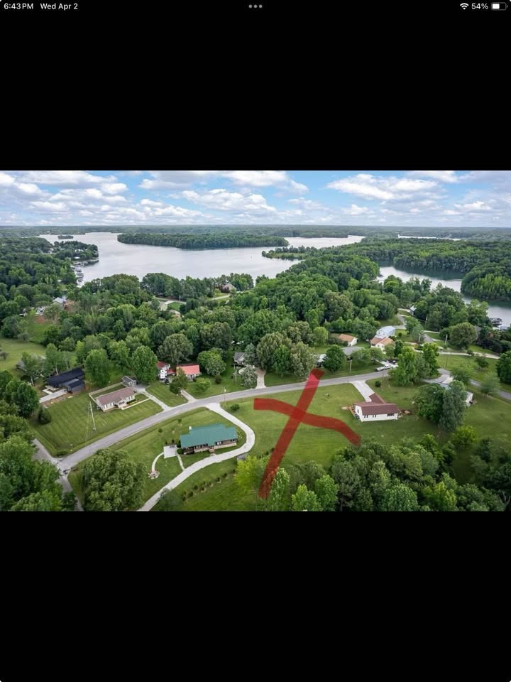 Just up the hill from the lake, this beautiful lot is approved for a 3-bedroom home. The front is flat with a gentle slope in the back—perfect for your weekend getaway cabin or a short-term rental investment. With no HOA dues, you’ll have freedom and flexibility to build what you want.