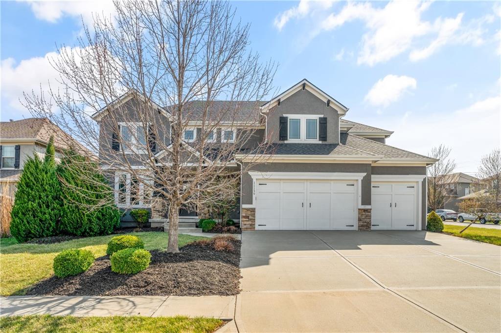 Gorgeous two-story home on a spacious corner lot in the highly desirable Cedar Creek – The Crossings, perfectly positioned on a quiet triple cul-de-sac with no thru traffic. Fresh interior and exterior paint (2022 & 2026) and a new roof in 2025. Step inside to gleaming, newly refinished hardwood floors and an open floor plan highlighted by soaring vaulted ceilings and a light-filled great room with large windows, built-ins, and a cozy fireplace. The beautifully designed kitchen features a large island with breakfast seating, walk-in pantry, butler’s pantry with beverage fridge, breakfast room, and a formal dining room—perfect for both everyday living and entertaining. A custom mudroom with built-ins and hooks provides an ideal drop zone just inside the home, and a main-level office and half bath add flexibility to the floor plan. Upstairs, the spacious primary suite offers a relaxing retreat with double vanities, a jetted tub, walk-in shower, and a large walk-in closet that connects directly to the laundry room for added convenience. Three additional bedrooms include one with a private en-suite bath and two that share a Jack-and-Jill bathroom. The open hallway overlooks the great room below, enhancing the home’s airy feel. The finished lower level expands the living space with a large rec room, full bath, and plenty of storage. Outdoor living truly shines here. The kitchen and breakfast area open to a deck and floor-to-ceiling windows along the east side of the home, bringing in beautiful morning light. The backyard is designed for gathering, featuring a spacious patio and a covered patio with a stone fireplace. An extended garage includes a rear door that opens directly to the patio, creating a seamless extension of the outdoor living space. Located within walking distance of Cedar Creek Elementary with convenient access to College Boulevard, this home offers a fantastic location within one of the area’s most sought-after communities. This one is truly a must see!