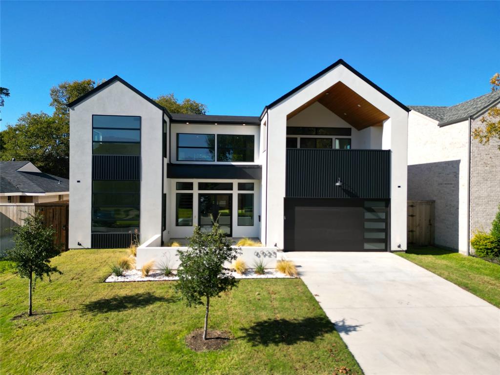 This Lakewood haven blends serenity and sophistication, with White Rock Lake & Lakewood Elementary's joyful echoes ensuring endless family tales. The steel-and-glass door swings open, ushering you into a soaring two-story foyer. Sunlight pours over the Mono-Beam floating staircase like liquid gold, drawing you into realms of quiet elegance. At its core, the chef's kitchen pulses with life: Wolf® range sizzling beside a 48-inch built-in fridge, the expansive London Sky Quartzite island a stage for whispered recipes and late-night laughs. Nearby, the butler's pantry beckons with a prep sink for convenience, cabinets guarding treasures, counters wide for feasts that feed the soul. White oak floors guide you to the first-floor primary suite, a whispered lullaby of luxury. Let the rainfall shower melt away worries, or sink into the vessel tub's steamy embrace, dreams resurfacing like old friends. A vast walk-in closet awaits, shelves alive with possibilities. Close by, a second bedroom and ensuite offer grace: for visiting kin, a grandparent's nook, or love's gentle pause. Climb the stairs to a world of wonder...3 ensuite bedrooms where young dreams flourish under vaulted skies. The game room hums with triumphs and secrets, leading to a balcony alive with twilight magic: movie nights under Texas stars, or firefly-kissed evenings that linger forever. Powered by Control4® smart tech, wrapped in efficient foam insulation, and backed by the Maverick® 1-2-10 Warranty. This home isn't mere design; it's the rhythm of lives intertwined. Where bonds strengthen, memories root deep, and every space holds the spark of home. Your chapter opens here, in luxury's warm hold.