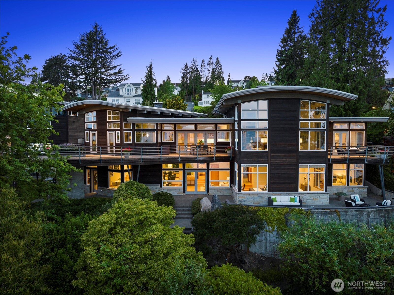 Exceptional Laurelhurst 1.17 acre Lake Washington waterfront estate w/155’ of prime frontage! 6,488SF 5BR 5.5BA home w/elegant atrium entry w/standing granite stone, barrel ceilings & walls of windows w/sweeping views of the sparkling waters of Lk WA, Mt Rainier & the Cascades, & golden sunrises from nearly every room. 2000 built one-of-a-kind masterpiece w/unique spaces & NW wood finishes, expansive view decks & patios, & 4 car garage. Arboretum-like grounds w/mature plantings & winding walkways to level lakeside gardens, walk-in cove & 95’ private dock on 2 lots. A+ location near Laurelhurst Beach Club, U-Village & easy commute to Seattle & Bellevue. Don’t miss this rare opportunity to own one of the great Laurelhurst waterfront retreats!