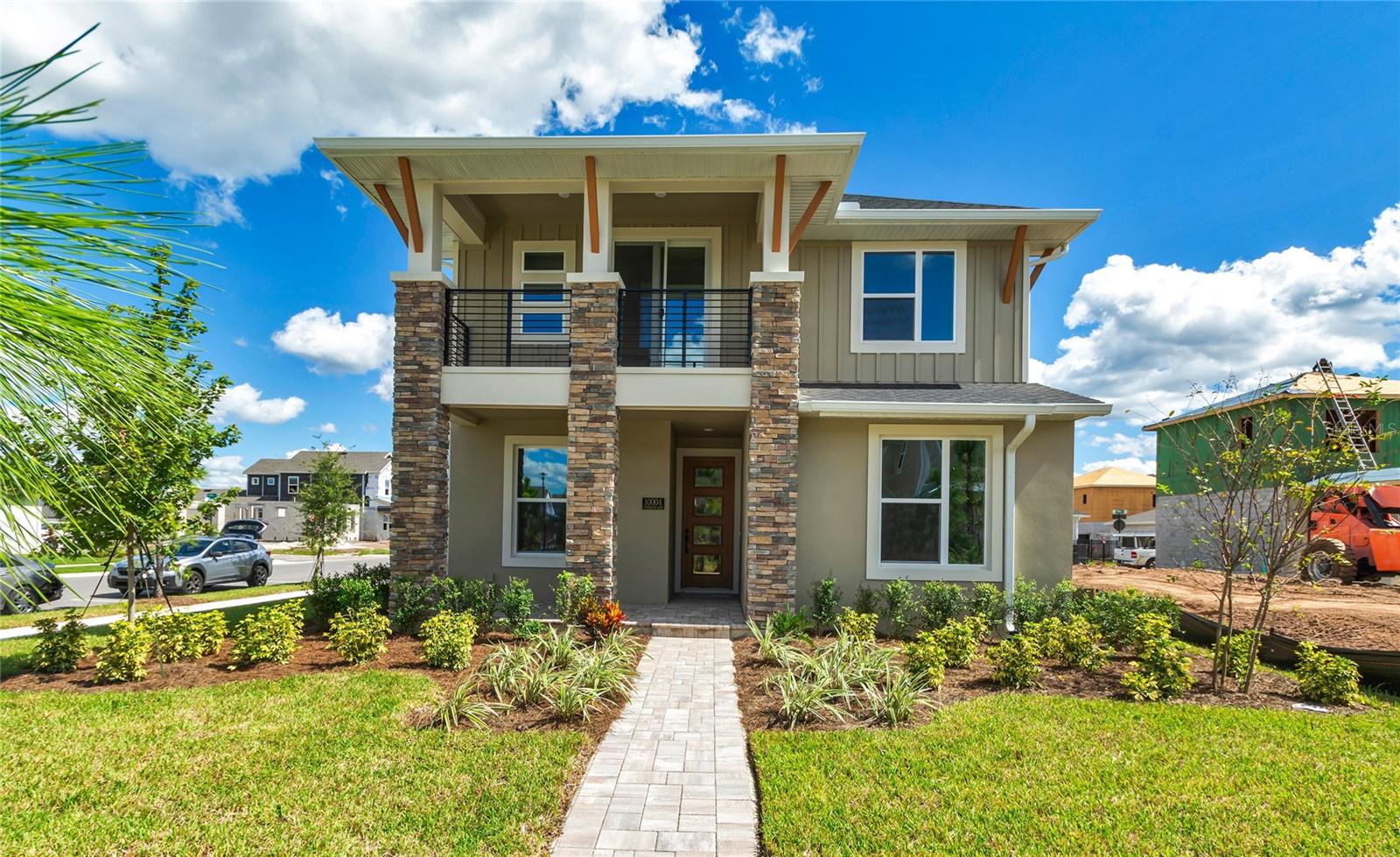 MOVE IN READY! CORNER HOMESITE with APARTMENT including full kitchen and laundry. Welcome to the Maui where luxury, lifestyle, and laid-back living collide on one of the most desirable corner homesites in the community, overlooking a beautifully landscaped park mew! Built by ICI Homes - Florida’s award-winning, family-owned custom builder - this move-in ready stunner offers the perfect mix of style, space, and high-end craftsmanship without the wait of building from scratch. With over 3,000 square feet of flexible living space, plus a PRIVATE GARAGE APARTMENT, you’ll have room for everything - and everyone. Step inside and feel the warmth of the open-concept design that effortlessly connects the living room, dining area, and chef-inspired kitchen. Entertain with ease or enjoy cozy family dinners under SOARING 12' CEILINGS, surrounded by QUARTZ COUNTERTOPS, SOFT-CLOSE CABINETS, a center island perfect for coffee chats, and luxury finishes that set the tone for Florida living at its finest. Slide open the oversized glass doors and step onto your covered lanai - a breezy outdoor extension ideal for barbecues, book reading, or unwinding with your favorite drink. The first-floor owner’s suite is your personal retreat, complete with a spa-like bathroom, dual vanities, and a spacious walk-in closet. Another bedroom downstairs is perfectly positioned for guests or multigenerational living. Upstairs, the game room gives you ultimate versatility—think movie nights, art studio, or homework zone—and is flanked by two additional bedrooms and a full bath. The game room has access to SECOND FLOOR BALCONY perfect for watching evening sunsets. And the icing on the cake? A fully self-contained garage apartment with its own kitchen, bathroom, laundry, and living area, ideal for in-laws, out-of-town guests, or even rental income. Whether you're seeking flexibility, privacy, or a touch of financial savvy, this bonus space delivers. Built to EQ Factor energy-efficient standards, with Low-E windows, hybrid hot water heater, and a 2-10 Home Buyers Warranty, this home saves you money and gives you peace of mind. Don't miss your chance to own a high-quality, move-in ready home by a builder who lives where they build - and builds like they care. The Maui isn’t just a floor plan, it’s a lifestyle upgrade, waiting for you on the perfect corner homesite.