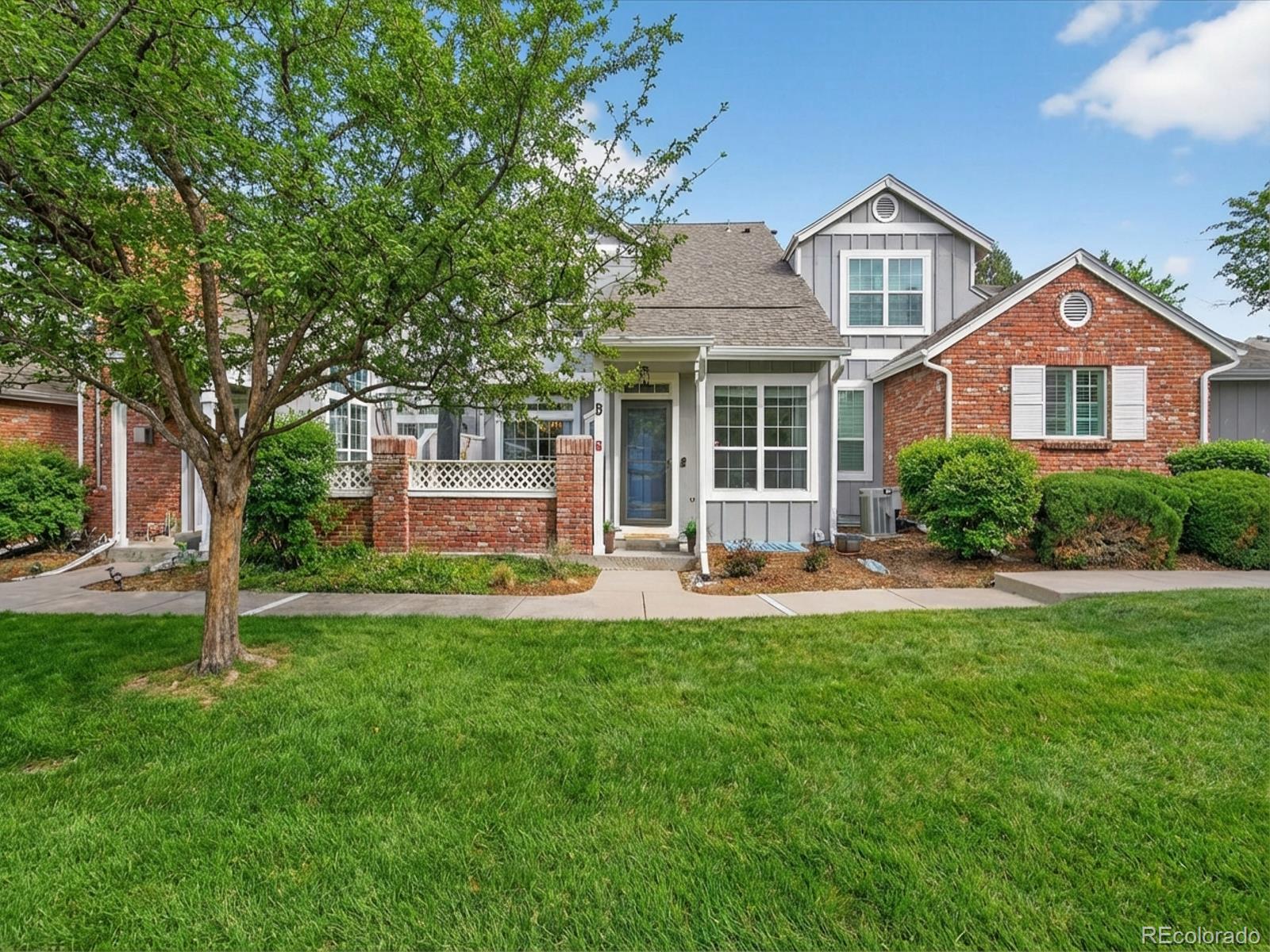 Welcome home to this light-filled Southpark townhome in Littleton!From the moment you step inside, you’ll be welcomed by soaring vaulted ceilings and an open, airy layout.Beautiful hardwood floors complement the cozy, tile-bordered fireplace, creating a warm and inviting living space.The bright kitchen features painted cabinetry, an updated backsplash, high counter seating, and a double oven—perfect for cooking and entertaining.The dining area opens to a private patio through sliding glass doors, ideal for relaxing or enjoying outdoor meals.Just off the kitchen is convenient access to the oversized garage with a spacious workbench for hobbies, crafting, or woodworking.The main level also includes a laundry area with built-in storage and a half bath with an updated vanity and faucet.Upstairs you’ll find two bedrooms, full bath and linen closet.In addition to the two bedrooms, the spacious primary suite overlooks the green space and offers a beautifully remodeled bathroom with tile flooring, tiled walk-in shower, double-sink vanity, and large walk-in closet.New carpet and paint throughout upstairs.The unfinished basement includes an egress window providing excellent potential for future living space.A radon mitigation system is already installed for peace of mind.Recent updates include: new roof, gutters, and downspouts (2024), a quiet Chamberlain garage door opener (2024), new lighting throughout, new patio railing, and fresh exterior paint (2025).An outdoor umbrella is included as well as TV mount over the fireplace.Enjoy an unbeatable location just minutes from Aspen Grove, Southwest Plaza, and charming Downtown Littleton, offering  shopping, dining, and entertainment.With easy access to light rail, Santa Fe Drive, and C-470, commuting is effortless.Community amenities include a pool, clubhouse, tennis courts, and pickleball courts.This move-in-ready home offers comfort, convenience, and an exceptional location, don’t miss the opportunity to make it yours!