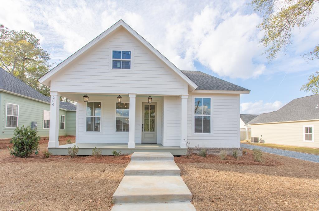 Located within The Victoria, an award-winning project situated inside the new Victoria Overlay, this brand-new 3-bedroom, 2-bath home blends historic Thomasville character with modern construction and convenience. Positioned just one block from the amphitheater and steps from downtown shops, dining, and entertainment, the location offers true walkable and golf-cart-friendly living—ideal for First Fridays and everything downtown Thomasville has to offer. You can truly smell the honey buns in the air.    This thoughtfully designed home offers an excellent flow and functional layout. The kitchen features abundant cabinetry and a walk-in pantry, serving as the hub between the dining area and great room while maintaining defined living spaces. A dedicated laundry room and mudroom add everyday practicality.    The spacious primary suite includes double-sink vanities, a luxurious shower, and a large walk-in closet. Every detail of the floor plan was designed for comfort, efficiency, and low-maintenance downtown living.    With 2,215 sq ft under roof, this home is ideal for those seeking the charm of a historic Thomasville aesthetic paired with brand-new construction, modern systems, and thoughtful design—including a tankless water heater and more.    A rare opportunity to enjoy classic style, modern comfort, and a premier downtown location within the Victoria Overlay.    Disclosure: Seller is a Licensed Real Estate Broker in the State of Georgia, License #340473.