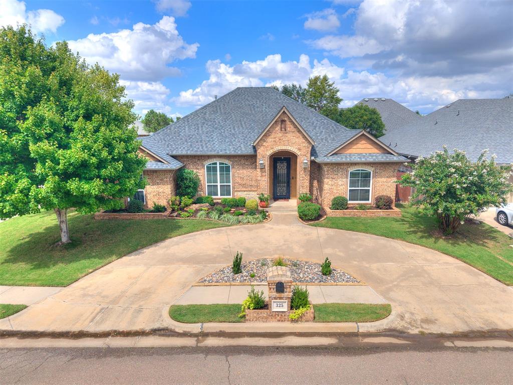Welcome to 325 SW 173rd St in the beautiful Talavera neighborhood. From the moment you arrive, you’ll love the large circle drive, 3-car side-entry garage, and corner lot with tasteful landscaping.

Step inside to an inviting open floor plan with tall ceilings and wood-look tile that not only looks great but is also durable and easy to care for.  Just off the entry, a dedicated study  with built in bookcases makes the perfect spot to work from home.  The open living, dining, and kitchen areas beg for family and guests to gather. The bright kitchen is a cheerful space with granite countertops, white cabinets, stainless appliances, dedicated pantry, and a center island makes meal prep a breeze.

Two secondary bedrooms share a hall bath, while the private primary suite located on the other side of the home features a stately tray ceiling and private backyard access.  The attached spa-like bath with soaking tub, walk-in shower, dual vanities, and a generous closet makes the primary suite a true retreat. A versatile bonus room with double doors adds flexibility as a fourth bedroom, playroom, teen space, guest room, or fitness studio - the options are endless. 

A brand-new roof (August 2025) and in-ground storm shelter provide extra peace of mind. Out back, relax on the roomy covered patio while enjoying the thoughtfully landscaped yard—ideal for morning coffee or evening wind down.

This home has the space, comfort, and features you need. Don’t miss it—schedule your private showing today!