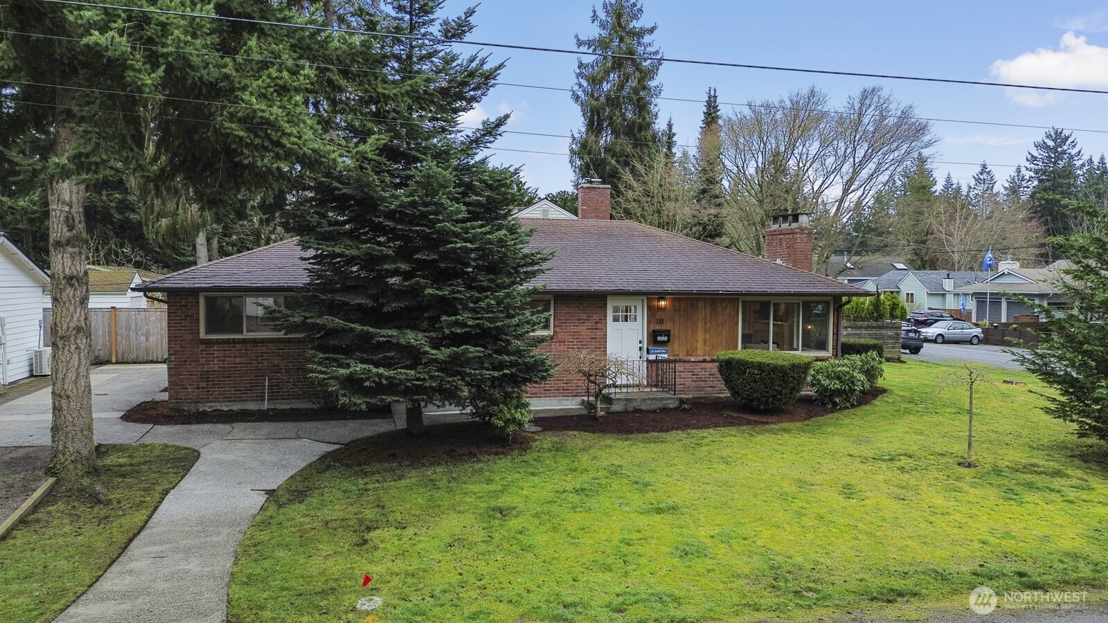 **Charming mid-century rambler in Broadview.** This 3BD, 1BA home features hardwood floors, a cozy living-room fireplace, and a beautifully remodeled kitchen with stainless steel appliances, quartz counters, and white shaker cabinets. Enjoy off-street parking and easy access to nearby shops, parks, and everyday amenities. A warm, inviting home in one of Seattle’s most peaceful neighborhoods.