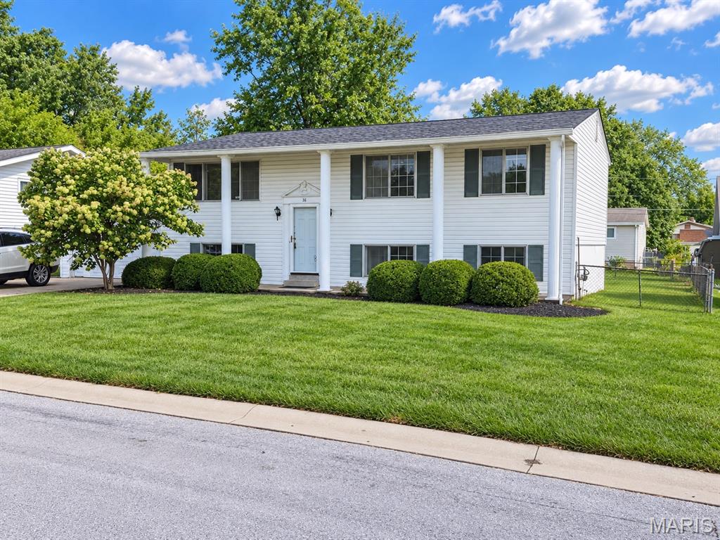 Bring your vision and make this one your own! 16 Saint Michael Drive offers a wonderful opportunity to update a well-built home with great potential. Clean and classic curb appeal, this split-level offers nearly 2,000 sq. ft. of living space with a layout that works well for everyday living. From the entry foyer, head upstairs to the living room, dining room, kitchen (new dishwasher 2024), three bedrooms and a full bath. The lower level adds a spacious family room with gas fireplace, fourth bedroom, second full bath, storage area with window, and laundry room/ work area with walkout access to the flat fenced yard complete with a concrete patio, covered deck from kitchen and a shed. Original hardwood floors on the main level have been uncovered and are ready to be refinished in the stain of your choice. Fresh paint and thoughtful updates would completely transform the interior, making this a great opportunity for a buyer who wants to personalize a home rather than pay for someone else’s renovation. The roof was replaced in February 2024.  A 1.5-car garage with a concrete driveway adds parking and storage. Property is being offered in its current, as-is condition, with seller making no additional repairs or repair credits. Buyers are welcome to perform their own inspections subject to the terms of the purchase contract. Vinyl Siding & Soffits. FORT ZUMWALT SCHOOLS. St Peters location! Nearby Parks, RecPlex, Restaurants & Shops! Close to Hwys- 70, 94, 364 & 370. A solid home with classic curb appeal, great potential, and plenty of room to create something special.