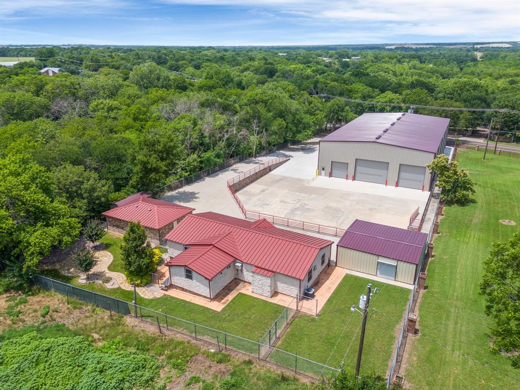 Prime property can be residential or commercially zoned. 1.2 miles from the Mckinney Airport, providing exceptional accessibility for logistics and travel needs.  Situated within the Extraterritorial Jurisdiction (ETJ), this property benefits from favorable zoning regulations and potential development options.  Whether you're looking for a home, a business with a home, a rental property or a combination of all, this property offers endless possibilities.  The property presents a unique opportunity for those seeking space, convenience, and flexibility in a beautiful setting.  No HOA.  Rare and unique property available on 1.25 acres in Mckinney outside of city limits.  The 3-bedroom, 2-bathroom home is spacious and designed with flexibility in mind.  The open layout offers plenty of room for customization-whether you want to create the perfect home or a fully functional office space.  The home comes complete with stainless steel appliances, washer, dryer and large picture window that provides expansive views of the industrial warehouse.  The owner thoughtfully added custom stonework to the exterior, enhancing both the aesthetic and the durability.  Built in 2024, the 9,880 sq ft warehouse brings high-quality space constructed with red oxide steel designed to maximum functionality.  A large industrial facility ideal for manufacturing, warehousing, or commercial use, featuring high ceilings 32' peak and 26' sides, ground level loading docks, office space, bathroom and more.  Specifications and more are loaded into the transaction desk in documents in ntreis.   Pricing includes commercial mls 20830199