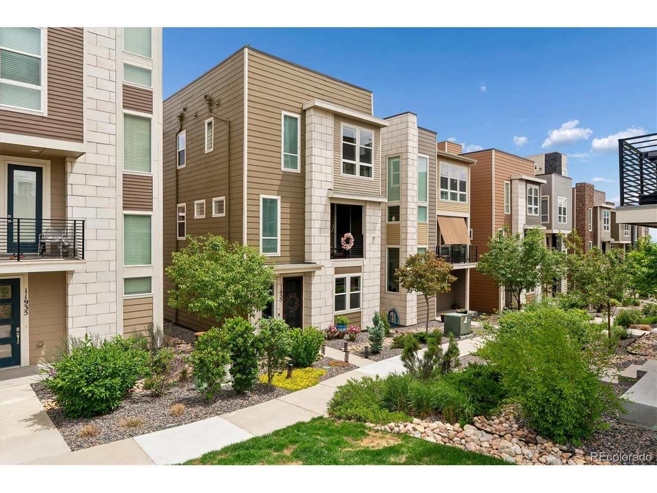 Who doesn't love a rooftop where you can relax, soak up the Colorado sunshine & feel like you're on top of the world? Take in beautiful city & mountain views, enjoy the fresh air or wind down at the end of the day from your own private rooftop terrace. Located in The Ridge at Broomfield, this stylish 3-level home offers 3 bedrooms, 3 baths & a bright, open floor plan with tasteful modern design throughout. The main level features a versatile study/office with a custom barn door, creating a private workspace that could also serve as a non-conforming bedroom. The kitchen makes a statement with designer granite countertops, stainless steel appliances, gas range, stylish backsplash, generous cabinetry & an eat-in area. Just off the kitchen, the spacious living area features 9-ft ceilings & plenty of natural light, with access to a private balcony and convenient storage room. Upstairs, you'll find two additional bedrooms, a 3/4 bath & a comfortable primary suite with dual sinks, an oversized shower & walk-in closet. Then head up one more level to the feature that truly sets this home apart-the rooftop terrace with impressive views of the city skyline & Rocky Mountains. Whether it's morning coffee, an afternoon soaking up the sun or an evening under the stars, this is outdoor living with a view. The 2-car garage offers even more functionality with a dedicated storage area for bikes plus overhead storage for all the extras. Conveniently located near Hwy 128 & Hwy 36 with easy access to Boulder & Denver, plus nearby parks, trails, restaurants, shopping & FlatIron Crossing.