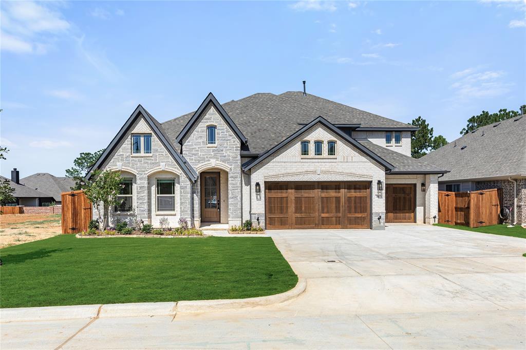 BRAND NEW! NEVER LIVED IN! Welcome to this exceptional two-story Primrose FE VI by Bloomfield Homes, a truly stunning residence that blends elegant design with upscale finishes and expansive living spaces, offering 5 bedrooms, 4.5 baths, a 3-car garage, private study, gameroom, media room, and formal dining. Rich hardwood flooring flows throughout the main living areas, setting a refined tone from the moment you enter, while the impressive rounded rotunda entry creates a grand architectural statement, with the study positioned just off the entry and enclosed by glass French doors for a sophisticated workspace. The deluxe chef’s kitchen is impeccably appointed with professional series appliances, including double ovens, a 5-burner cooktop, and vent hood, complemented by upgraded quartz countertops, pendant lighting over the island, under-cabinet lighting, and abundant cabinetry, all designed to impress while remaining highly functional. The expansive family room is nothing short of breathtaking, featuring soaring vaulted ceilings, an upgraded stair railing, and a dramatic floor-to-ceiling tile fireplace that anchors the space with both warmth and style. The luxurious primary suite offers a spa-inspired bath complete with upgraded tile flooring, enhanced shower tile selections, and elegant quartz countertops, creating a serene retreat. Upstairs, two generously sized bedrooms each pair with their own bathrooms, along with a spacious gameroom and an enclosed media room with French doors, perfect for elevated entertaining. Completing this remarkable home are a covered front patio with an impressive 8-foot front door and a covered back porch, offering inviting outdoor living spaces that match the home’s level of sophistication.This home truly blends luxury, comfort, and functionality in a prime Bedford location. Don’t miss your opportunity to own in Grace Park—schedule your tour today and experience everything this exceptional home has to offer!
