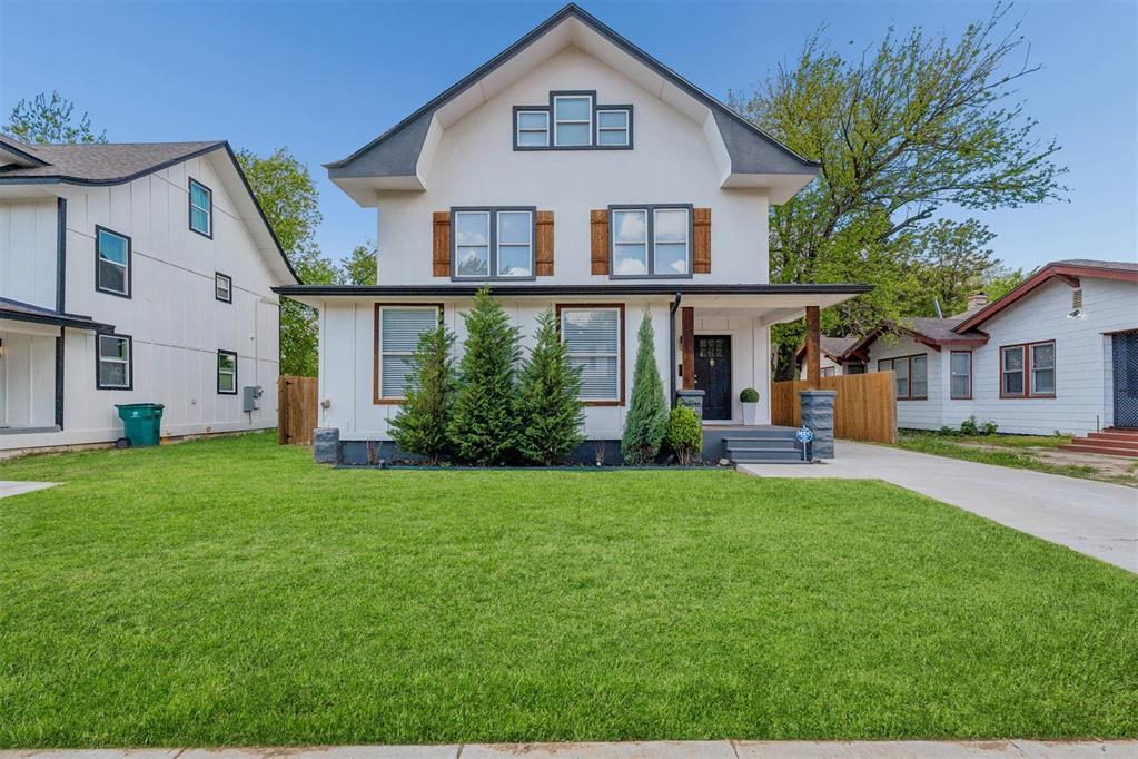 Beautifully updated home blending modern finishes with timeless charm in a prime location! This spacious property features an open-concept layout with abundant natural light, hardwood floors, and a seamless flow between living, dining, and kitchen areas—perfect for both everyday living and entertaining.The kitchen is a standout with crisp white cabinetry, sleek countertops, stainless steel appliances, gas range, and a large island with seating. Stylish pendant lighting and open shelving add a designer touch.The living area offers a warm and inviting feel with a statement fireplace feature wall, while the adjacent dining space is filled with natural light from multiple windows.Upstairs, the primary suite is bright and airy with ample space, multiple windows, and a beautifully updated en-suite bath featuring dual vanities, a soaking tub, and a custom tiled walk-in shower. Additional bedrooms are generously sized with great natural light.The exterior offers strong curb appeal with a welcoming front porch, clean modern lines, and a long driveway for ample parking. Backyard space provides room to relax or entertain.Move-in ready with thoughtful updates throughout—this home combines style, function, and comfort in one complete package!