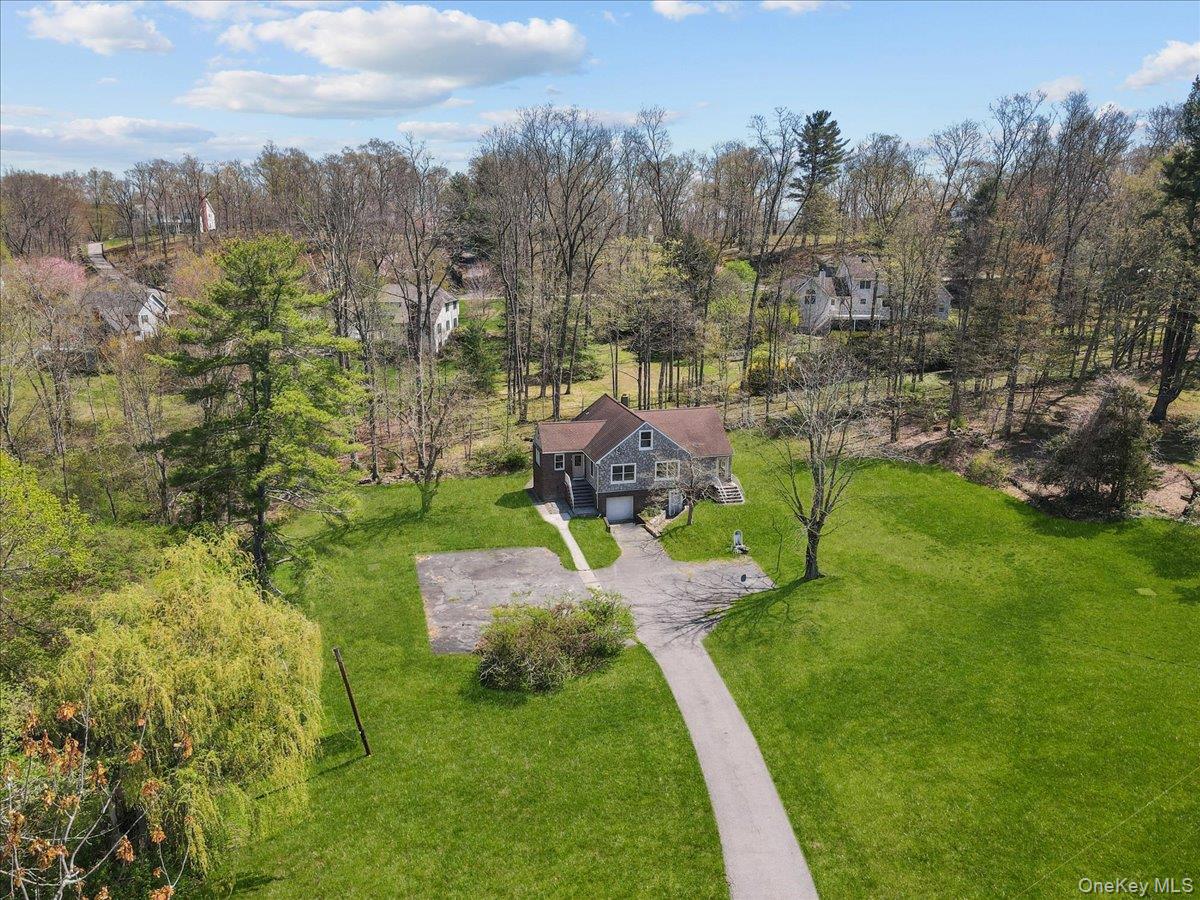 Welcome to 9 South Lane, privately set on 1.28 acres in the Somers School District with a Katonah PO. This home offers a spacious layout with a full second level and a 726 sq ft lower level with excellent finishing potential. Needs updating, presenting a great opportunity to renovate, customize, and build equity. Room to expand and reimagine to suit today’s living. Conveniently located just minutes from Katonah Village, Metro-North, shops, and major highways. A rare offering with tremendous potential in prime Northern Westchester.