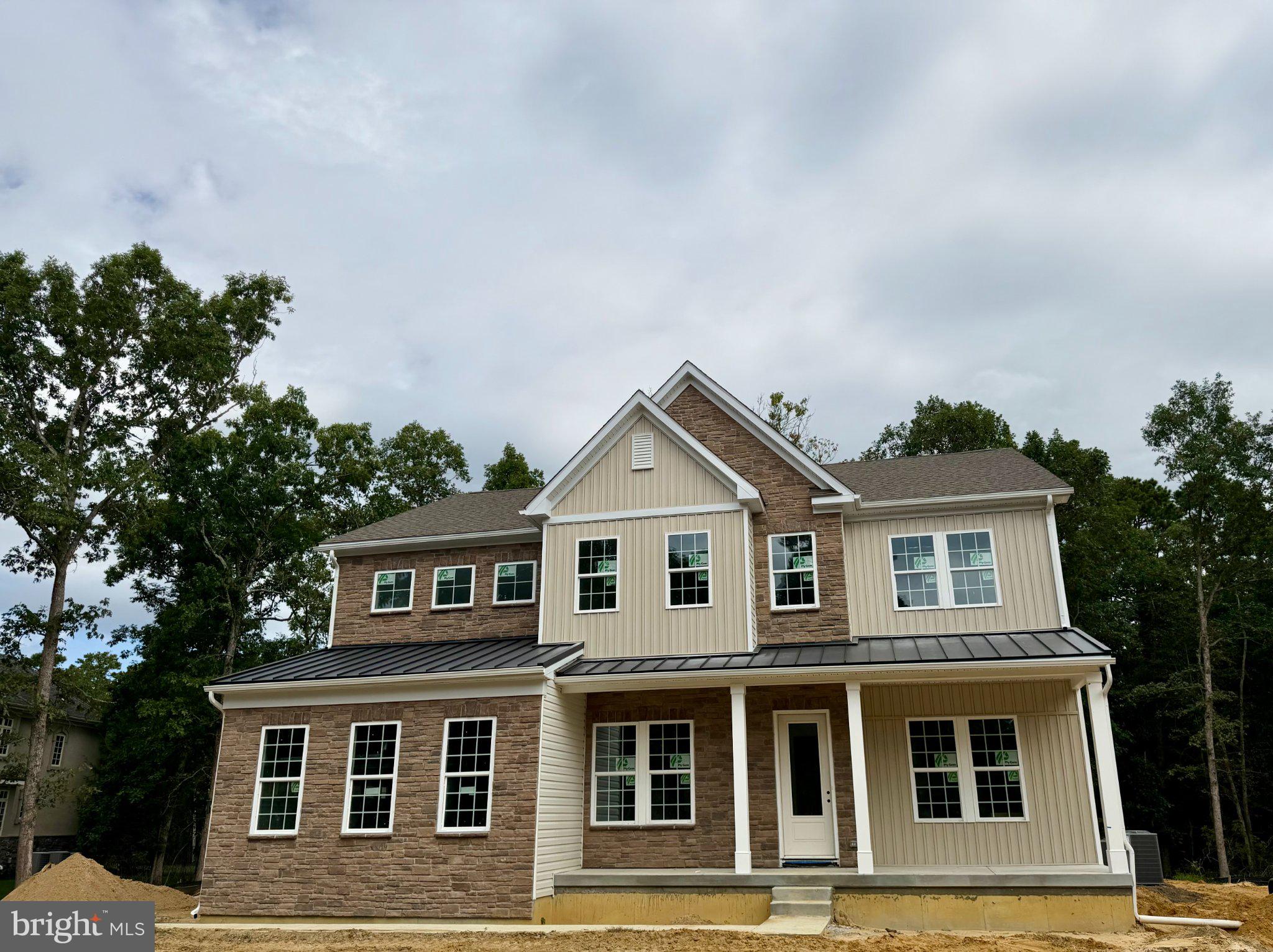 This home is currently under construction and will be ready for a November move-in! Welcome to 4 Elderberry Drive, a beautifully reimagined estate tucked away on a private, wooded lot in one of Medford’s most sought-after neighborhoods.Experience luxury living in this stunning new construction home tucked away on a private, wooded lot located in one of Medford’s most sought-after neighborhoods. Combining modern elegance with exceptional functionality, this beautifully designed residence offers the perfect blend of small-town charm, top-rated schools, and an active outdoor lifestyle.Boasting five spacious bedrooms and four full bathrooms, this thoughtfully crafted home provides ample space for both everyday living and entertaining. The inviting open-concept floor plan features a formal dining room for special gatherings and a versatile flex space that can serve as a private study, home office, playroom, or additional living area. Off of the kitchen is a first-floor bedroom with a walk-in closet and adjacent full bath, offering convenience and privacy for guests. At the heart of the home, the gourmet kitchen is designed to impress with a large quartz center island, abundant cabinetry, and seamless flow into the expansive family room—creating the perfect setting for hosting family and friends.Upstairs, a central loft serves as a welcoming gathering space and leads to four secondary bedrooms as well as the luxurious primary suite. The owner's retreat offers a private sanctuary complete with dual walk-in closets and a spa-inspired en-suite bath designed for comfort and relaxation.Additional highlights include a full unfinished basement offering endless possibilities for future customization, a desirable two-car side-entry garage, and quality craftsmanship throughout.Don't miss this rare opportunity to own a brand-new luxury home in a premier Medford location, where timeless design, modern conveniences, and an exceptional lifestyle come together.Disclaimer:  For purposes of the Exterior Design only- exterior color and garage location may differ from picture.