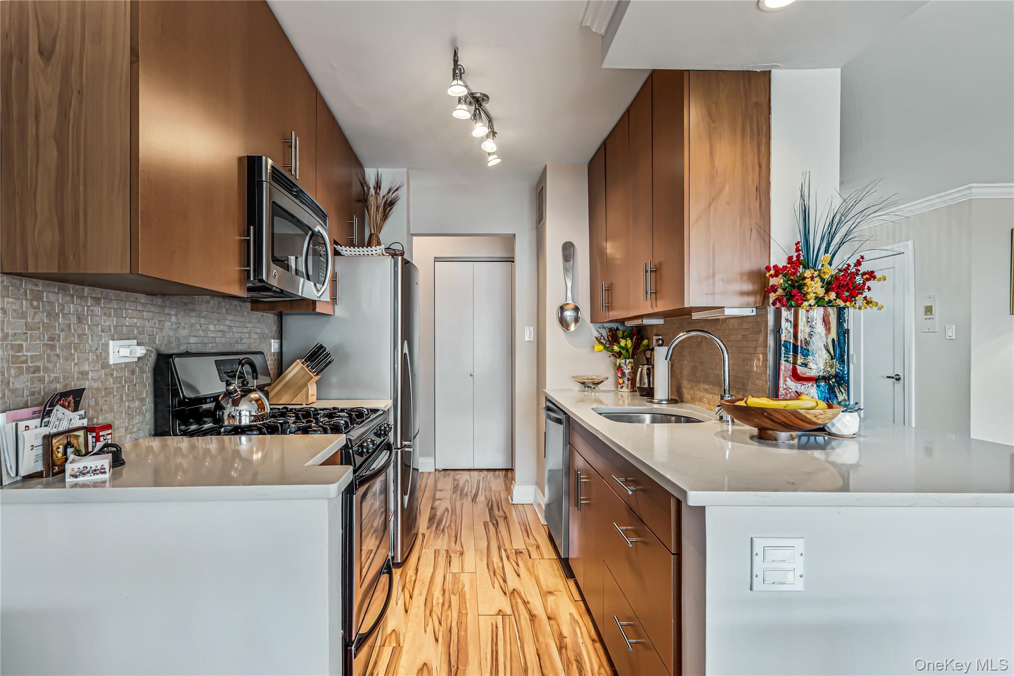 Beautifully Renovated Large 1 bedroom Deluxe (Jr. 4) in Luxury high rise building. 24 hour Doorman/Security. Large bedroom,Living Room,Dining Room(can be used as an office or 2nd bedroom) . An abundance of closets,  Oversized custom bathroom. Large Balcony with Gorgeous views of the New York City skyline and Long Island Sound. Deli, State of the Art Gym, Beauty spa, Entertainment room, tennis/pickle ball, Dry Cleaner. Close to shopping Center,  transportation (Local and Express buses to Downtown Flushing, NYC,+The Bayside  LIRR). Maintenance $1779 +assessments of $203.29 +100 Total out of pocket expense =$ 2081.35 Includes Central Heat ,Air Conditioning, Gas, Electric, Water & Real Estate Taxes. Indoor Parking Available @ $190 Month. Cable and Special Spectrum pkg available Cable +Internet $70 per month