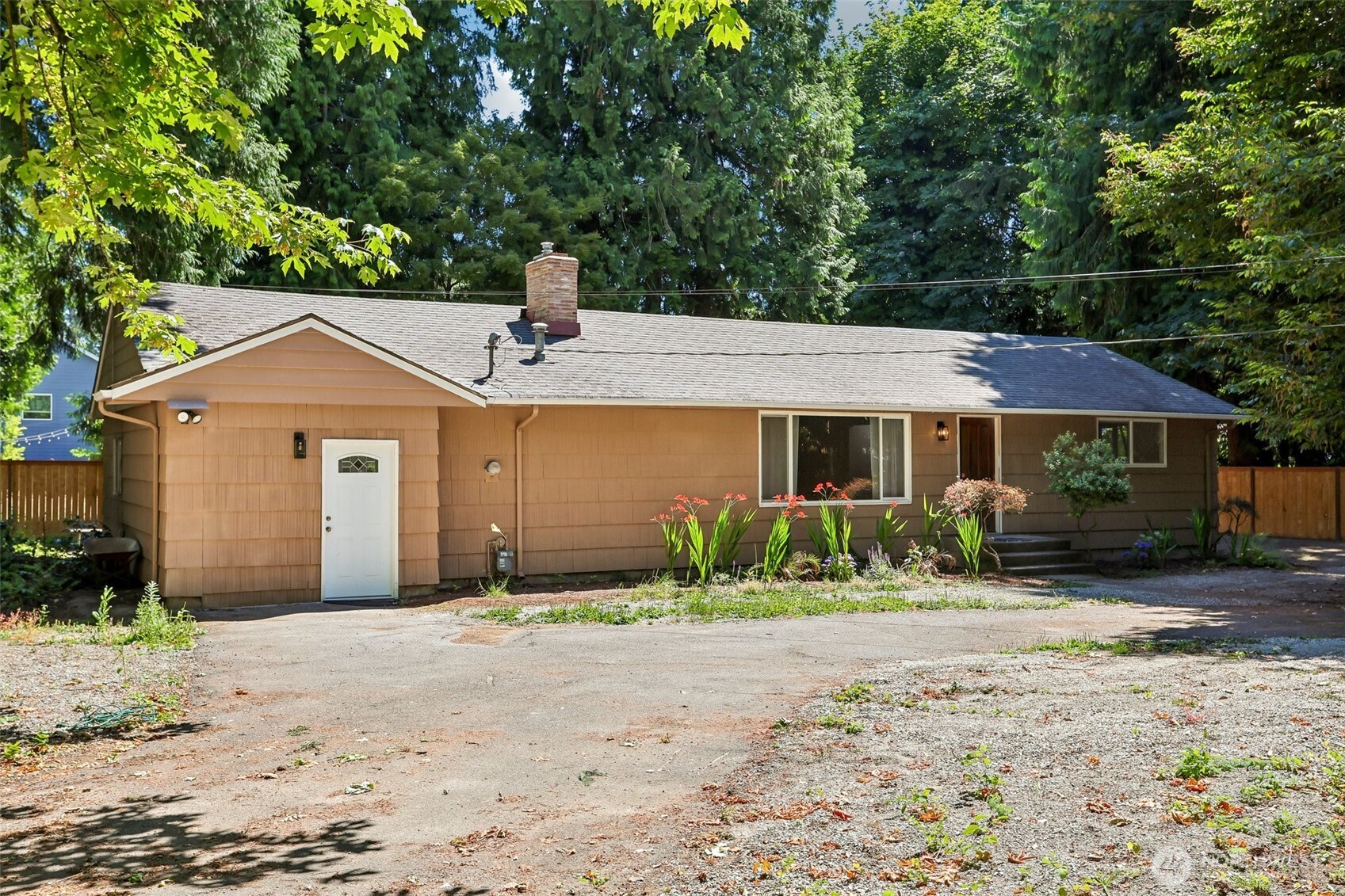 Conveniently located house on large fully fenced and gated lot with a Horseshoe Driveway to handle plenty of parking.  Less than .25 mile to Trader Joe's, CVS. and PCC Market.  There is a backyard deck for BBQs and you can access a more private deck from Master Bedroom.  The house features two fully renovated bathrooms and renovated kitchen.   The garage was renovated into either a large family room with a closet or considered another bedroom.    The Master Bedroom has its own full bathroom with separate bath and shower and a Walk-in Closet.