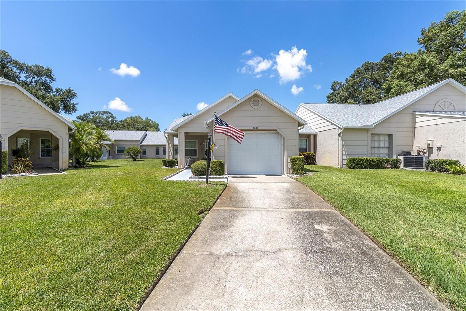 CUTEST AND LOWEST PRICED 2/2/1 CONDO IN THIS POPULAR ADULT COMMUNITY IN THE TRINITY AREA!  THIS SWEET DEAL IS GONNA' GO FAST SO BE FIRST IN LINE!  OPEN SPACIOUS FLOOR PLAN GREAT ROOM STYLE WITH LAMINATE & CERAMIC IN ALL THE RIGHT PLACES!  FEATURING A FORMAL DINING ROOM AND THE EAT IN KITCHEN IS LINED WITH CABINETS, HAS A HANDY PANTRY COMPLETE WITH ALL APPLIANCES!  BOTH BEDROOMS ARE A GENEROUS SIZE; THE PRIMARY HAS A NICE WALK IN CLOSET AND PRIVATE UPDATED BATH!  EVEN THE GUEST BATH HAS A FEW UPDATES!  ENJOY A BREEZY FRONT PORCH!  IT IS A SHORT WALK ALONG WINDING TREE LINED STREETS DOTTED WITH SERENE PONDS TO THE ACTIVE CLUBHOUSE THEY OFFER MORE ACTIVITIES THAN YOU CAN KEEP UP WITH... HEATED POOL AND SPA, TENNIS CTS, BOCCE, PICKLEBALL, POOL & BILLIARD ROOM, CRAFTS, LIBRARY, CARD ROOM, EXERCISE CLASSES, DANCES, PARTY'S, BBQ'S THE LIST IS ENDLESS!  ADD IN ALL THE AMENITY'S THE TRINITY AREA OFFERS AND THIS IS A STEAL!  HURRY TO THIS ON! HESITATE... AND YOU'LL BE TOO LATE!