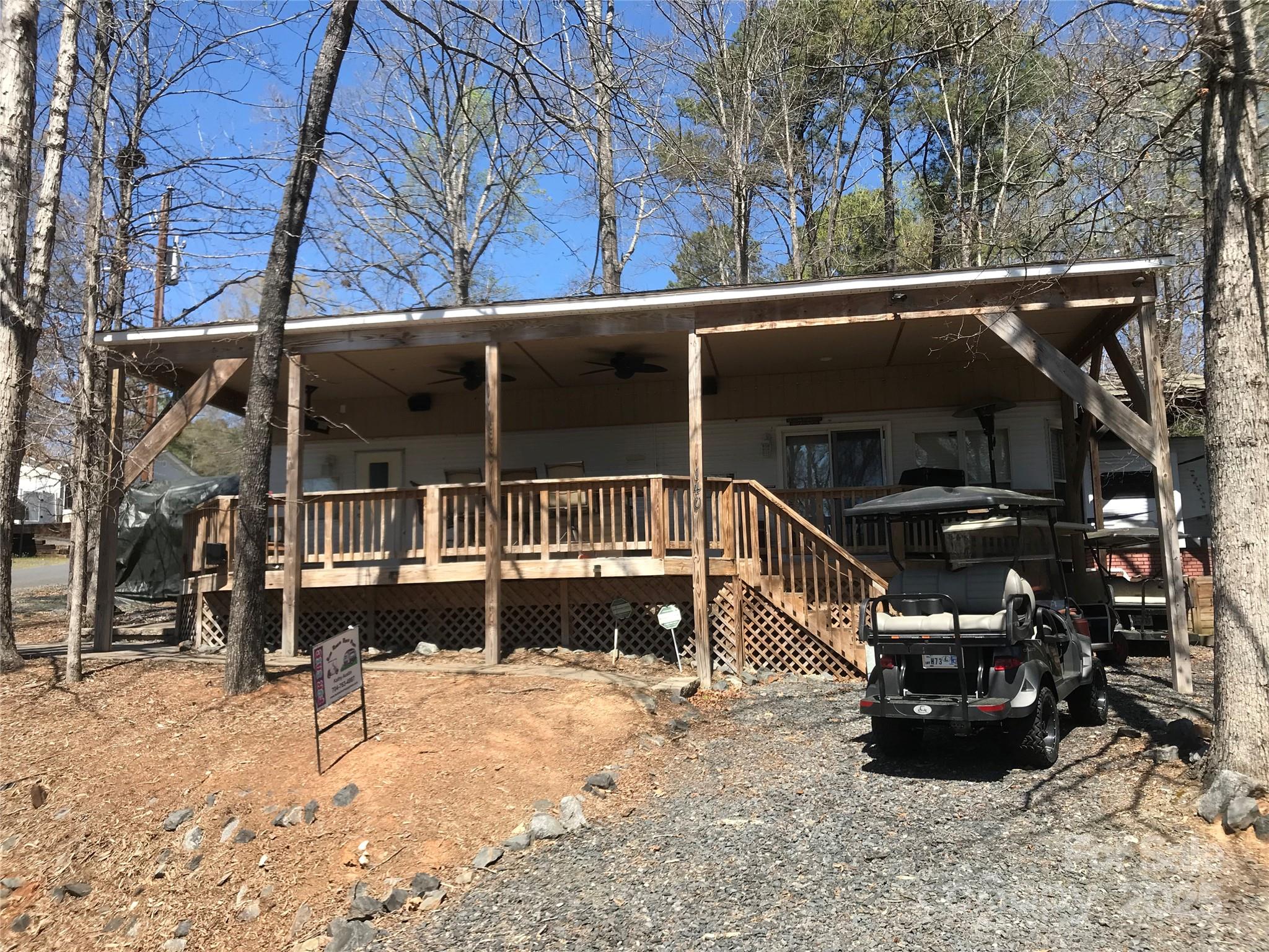 Awesome unit here in the park. 2002 Breckenridge Park Model. Very well maintained, including 12k in pavers, refrigerator is 1 yr old, new sliding glass door, new LVP flooring, newer blinds, tv to remain for deck, 2002 Club Golf cart, no black tank.  Tons of storage in bedroom, secondary bedroom on other end of unit. Both couches turn into beds. Pop up counter in kitchen for additional counter space as needed, full size appliances. Now step outside to the covered deck with build in bar height table with power. Well built structure with fans, large tv, nice grill, outside heater, Sonos Speakers inside and out with 2 zones. $5k in cameras, security and other upgrades. Large shed in box to remain. Storage building, owned propane tank but current owner does not use. He uses plugin heaters when there in winter. All furniture to remain.  Clients must be with a realtor to gain access to community.