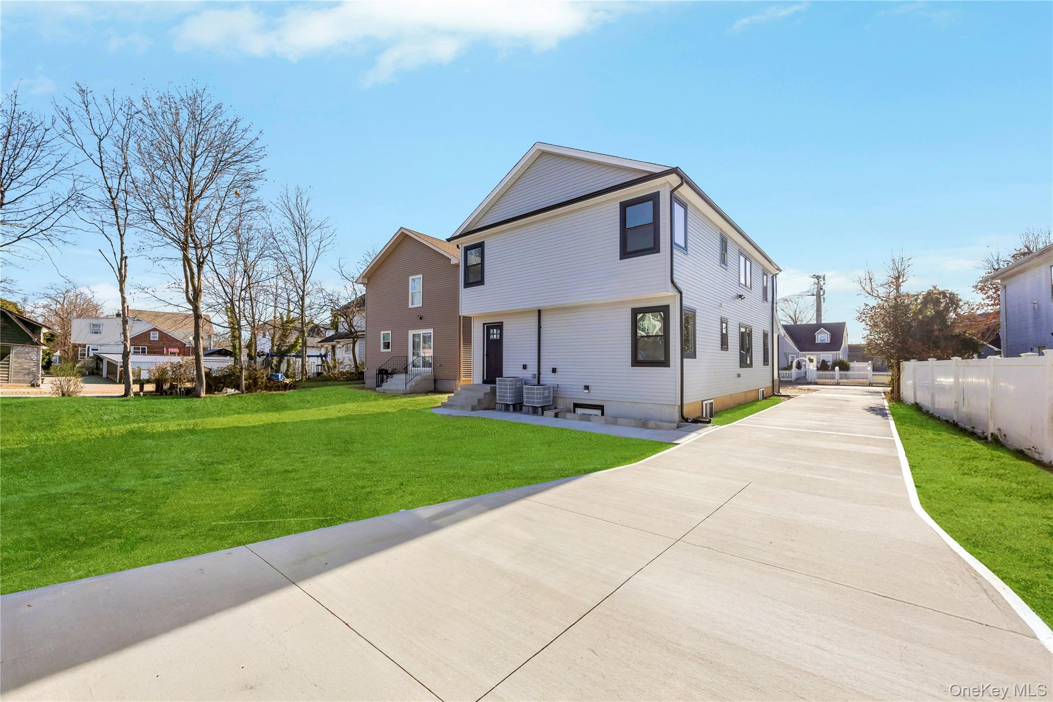 New construction colonial on an 87 x 147 lot. 6 bedrooms, 3 full bathrooms, open layout. Elegant kitchen with modern finishes. Front porch sitting area. Basement with soaring ceilings and private separate entrance. Central air for heating and cooling. Long driveway and oversized 2 car garage. Move in ready. Photos virtually enhanced. Basement Square Footage not Included; approximate additional 725 sq ft. Floor plan available upon request.