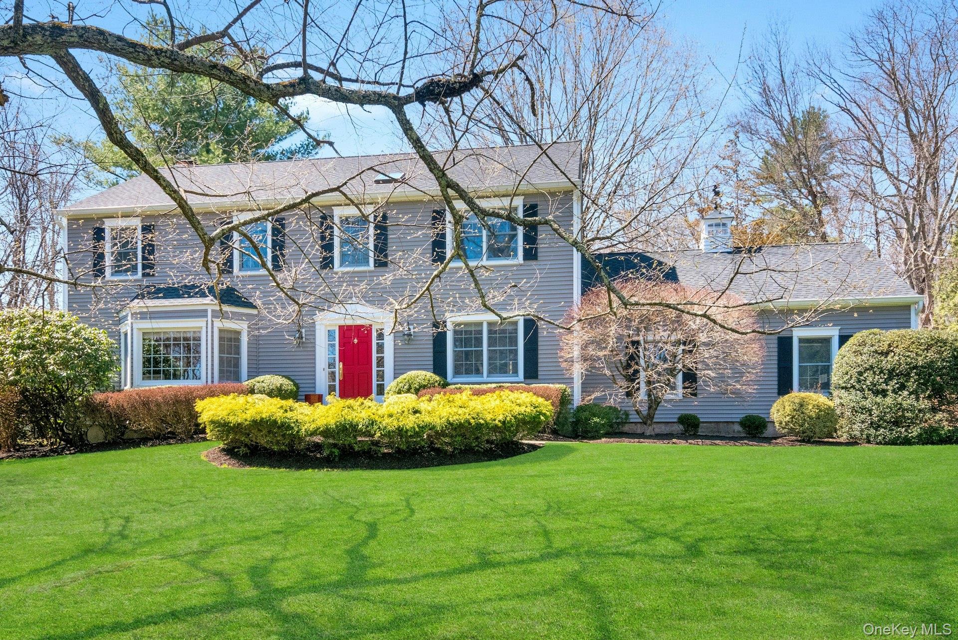 A Modern Colonial Retreat, 83 Upper Shad Road, is situated on 2.25 private, level acres in the heart of Pound Ridge.  Mature trees and professionally designed landscaping create a serene, park-like environment, with an in-ground pool and manicured green expanses that surround the home. (Did I forget to mention the babbling brook at the corner of the property?)   The home features a primary bedroom suite plus 2 additional, generously sized bedrooms, 3.5 bathrooms, living room, den, formal dining room and kitchen with center island. The finished lower level adds an open-plan living area with a large office, library, entertainment center, and full bath.  The heart of the home is a breathtaking living room featuring double-height, vaulted ceilings and classic wood-burning fireplace. French doors open to the patio dining area and offer clear views of the private backyard and sparkling heated pool.  Adjacent to the living room, a separate den and large dining room open onto each other, making the space perfect when hosting large gatherings. The Chef’s kitchen features a large central island and abundant cabinets with room for a cozy breakfast nook. The formal dining room adjoins the kitchen, while the kitchen backdoor flows directly onto a private deck--an ideal BBQ space overlooking the pool and gardens. Just beyond the deck is a large stone patio perfect for seasonal dinners. The gated sparkling gunite pool and expansive deck area are flanked by lush flowering landscaping including magnificent rhododendron, Japanese maples, hydrangeas, and an array of colorful flowering plantings. A cedar shed, an attached 2-car garage and Invisible fencing help keep your cars and tools snow-free and your pets secure. The total square footage of the home includes the large finished lower level. The location offers exceptional convenience, just minutes from shopping and dining in Pound Ridge, Bedford, New Canaan, Stamford and Ridgefield. Commuters will appreciate the easy access to the Merritt Parkway and I-684, as well as the nearby Metro-North stations.