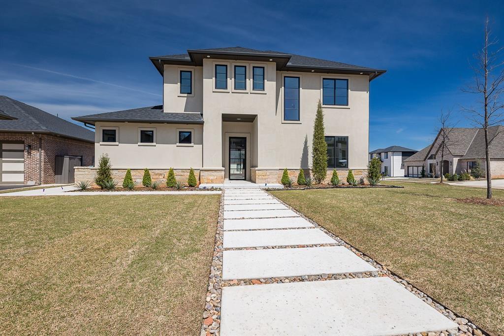 PHASE 1 MODEL HOME CLOSEOUT in Wiregrass at Oak Tree! Lots of included model home features and upgrades at a great price. No cost to buyer Model Home extras include: full fencing, backyard landscape package, epoxy garage flooring, wood floors in master bedroom, Monogram appliance package, built-in fridge/freezer, and oversized three-piece patio sliding door. Modern design with clean lines, stone and stucco exterior sitting on large corner lot with side load and oversized 3 car garage. Private back yard with large, covered patio with fireplace. Two story entry. Pantry with quartz counter tops and outlets for small appliances. Master bath with separate vanities, linen and make up area as well as large master closet with solid cut to fit closet rods. Upstairs includes two large spare bedrooms with a jack and jill bath, open game room, additional loft for study or hobby area, and holiday storage room - perfect storage or craft room. Designer Emtek door hardware and Monte Cristo iron front door. Tankless hot water system and recirculating system. Impact resistant roofing shingles. Wiregrass is a boutique community in the heart of Oak Tree - Country club memberships available for social, fitness and golf. Come see this fabulous Model Home today!