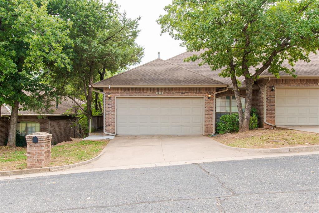 For Lease | 1718 Windhill Ave, Edmond, OK | $1,650/monthWelcome to this beautifully maintained 2-bedroom, 2-bath home with a dedicated office and 2-car garage located in a quiet, wooded East Edmond neighborhood. This flexible floor plan offers the perfect setup for those needing a home office, guest space, or work-from-home layout.The spacious living room features a cozy fireplace and flows seamlessly into the kitchen, complete with an electric stove/oven, microwave, dishwasher, and pantry for everyday convenience. The large office includes French doors and a closet, making it an ideal option for a third bedroom, study, or flex space.The primary suite offers a relaxing retreat with double vanities, a separate tub and shower, and a walk-in closet. The secondary bedroom is privately located on the opposite side of the home, also featuring a walk-in closet and nearby full bath—perfect for guests or roommates.Enjoy low-maintenance living with no backyard to maintain, while the front yard care is handled by the HOA and included in the rent. Conveniently located near shopping, dining, and major commuter routes, this home combines comfort, function, and location in one of Edmond’s most desirable areas.