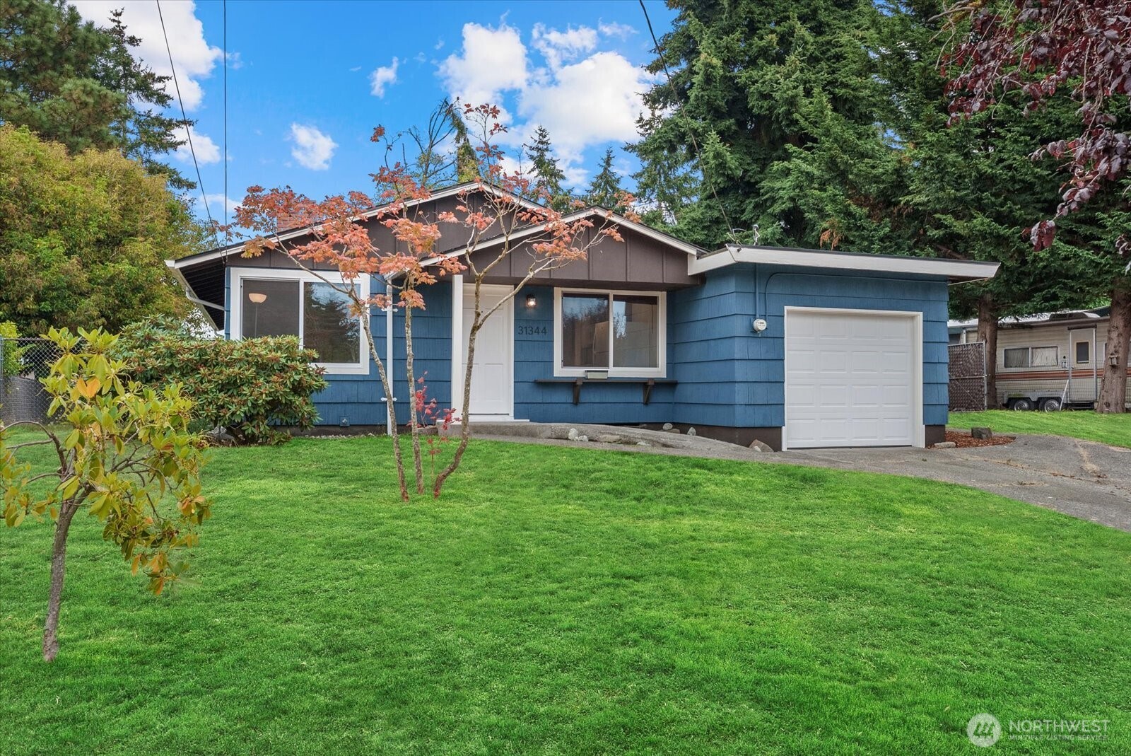 WOW FANTASTIC ONE STORY 3 Bedroom Home LOCATED on A FENCED & GATED  LEVEL 9,375 SF LOT W/ Space for RV PARKING !! This Spectacular Better Then NEW Home Is Located Between Down Town Federal Way & Soundcrest Community, Walking Distance Away From Great Shopping & Dinning. GAS FORCED AIR HEAT, Large Living Room w/ BRICK FIREPLACE, Gorgeous NEW VINYL PLANK FLOORS Thru out the Entire FRESH PAINTED & UPDATED INTERIOR. Open & Bright KITCHEN w/ Eating Space & NEW CABINETS w/ Chrome Hardware , STAINLESS STEEL KITCHEN SINK w/ GOOSE NECK FAUCET & NEW DISHWASHER & Appliances. Organized Separate UTILITY ROOM w/ Amanda WASHER & DRYER included. Shop Area & One CAR GARAGE w/ NEW GARAGE DOOR & AUTO GARAGE OPENER. FANTASTIC WHITE SOLID CORE PANEL DOORS Thru out w/ New Chrome Door Knobs And Hinges. THREE BEDROOMS All In Excellent Shape W/ Organized Closets. GR8 Looking Light Fixtures. LARGE FULL BATHROOM with FANTASTIC BATH TUB and NEW SHOWER SURROUNDS & GR8 NEW BATH RM Cabinet & Sink RECENT NEW COMPOSITION ROOF & WHITE VINYL WINDOWS & FRESH PAINTED EXTERIOR, Fully Landscaped FENCED Back Yard Perfect For Pets REALLY A GR8 HOME