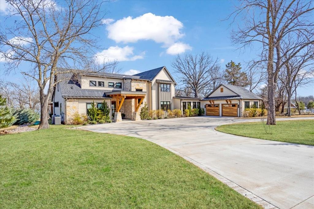 Poised on a premium lakefront lot along the shimmering shores of Lake Texoma, 210 Coffee Circle is more than a home, it’s a private retreat designed to elevate your everyday living. This custom 4 bed, 3.5-bath masterpiece spans 4,000 sq. ft. of meticulously crafted space, where every sunrise and moonrise reflected on the water feels like a scene from a dream. Inside you’ll find a seamless blend of luxury and comfort. The gourmet kitchen is outfitted with top of the line appliances, hidden pantry and huge island. Smart home tech ensures modern convenience at your fingertips. Two living areas create the perfect balance for entertaining and relaxation. The living room, with its handsome wood beams and crackling fireplace, is made for cozy evenings. Oversized sliding glass doors blur the line between indoors and out, offering uninterrupted lake views. The den is an entertainer’s haven, featuring a sleek built-in bar complete with beverage cooler, wine fridge. This space flows effortlessly into a charming enclosed porch, perfect for sipping morning coffee or unwinding with a good book. The primary suite is a true sanctuary, boasting a spa-like en-suite bath with double sinks, soaking tub and a walk-in shower—your personal retreat for relaxation. Upstairs, a spacious loft provides the flexibility to create an office or lounge. Three additional bedrooms and two baths offer plenty of room for family and guests, including one oversized bedroom that could easily transform into a game room. Outside is a lakeside paradise. A sprawling deck and covered patio offer stunning panoramic views! Room to add a pool for additional outdoor entertaining. Pergola with its charming swing, perfect for soaking in the tranquility of the lakefront setting. Exceptional beach access from property. Thoughtfully designed and built by current owners, to merge elegance and practicality, this home is ready to host cherished memories. Don’t miss the chance to own this rare gem on Lake Texoma.