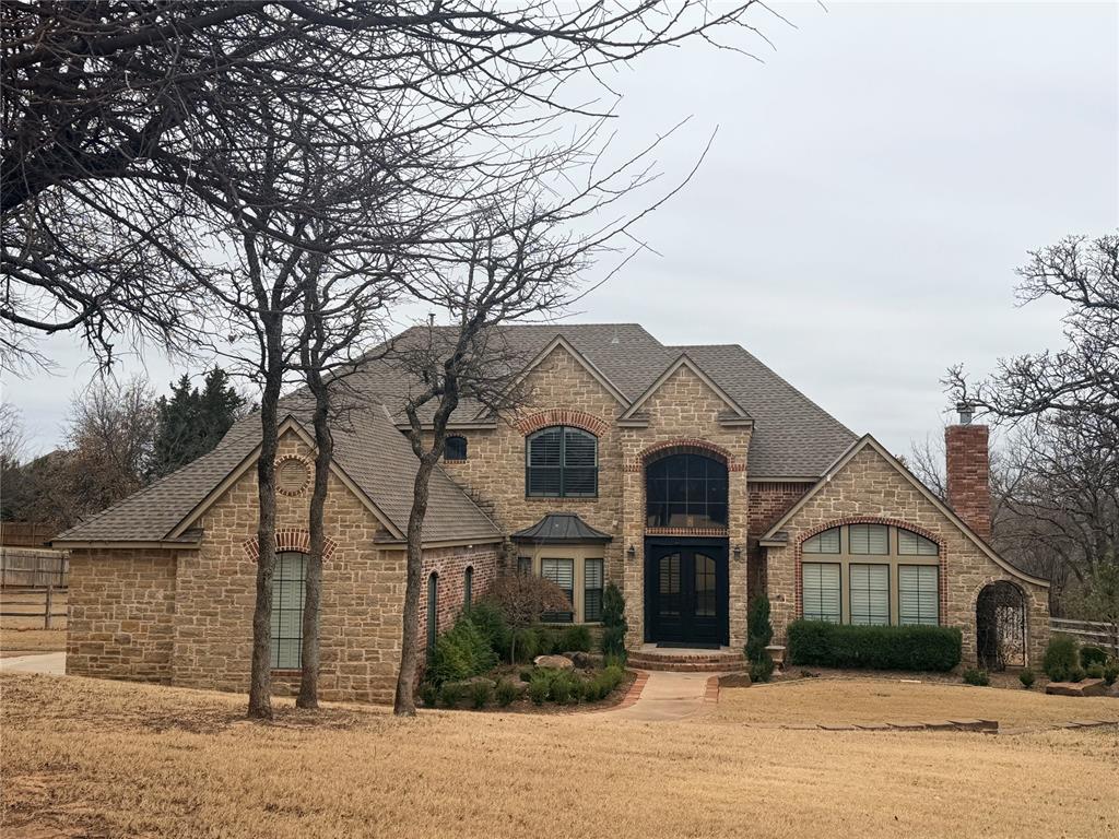 This is one of those homes that’s hard to believe exists right in town. Sitting on approximately 1.4 acres just off Coffee Creek, it offers the space and privacy you usually have to drive way out to find, without giving up convenience.Let’s talk about the backyard first, because it’s the star. Heated pool, hot tub, fire pit, outdoor kitchen with built-in grill, and a wide, level lawn that’s perfect for kids, sports, or entertaining friends. The mature trees and greenbelt setting make it feel like a private retreat, and the wall of windows across the back of the house lets you enjoy those views from inside all year long.The layout just makes sense. Three bedrooms and two full baths upstairs, with a main-level bedroom, study, and additional living and dining spaces downstairs, plenty of room for everyday life, hosting, or working from home. Thoughtful design details are everywhere, from custom built-ins and a coffered kitchen ceiling to exposed wood beams in the living room that add warmth and character.It’s rare to find this much land, this much privacy, and this level of comfort in such a prime Edmond location. This one truly feels like home the moment you pull in the drive.