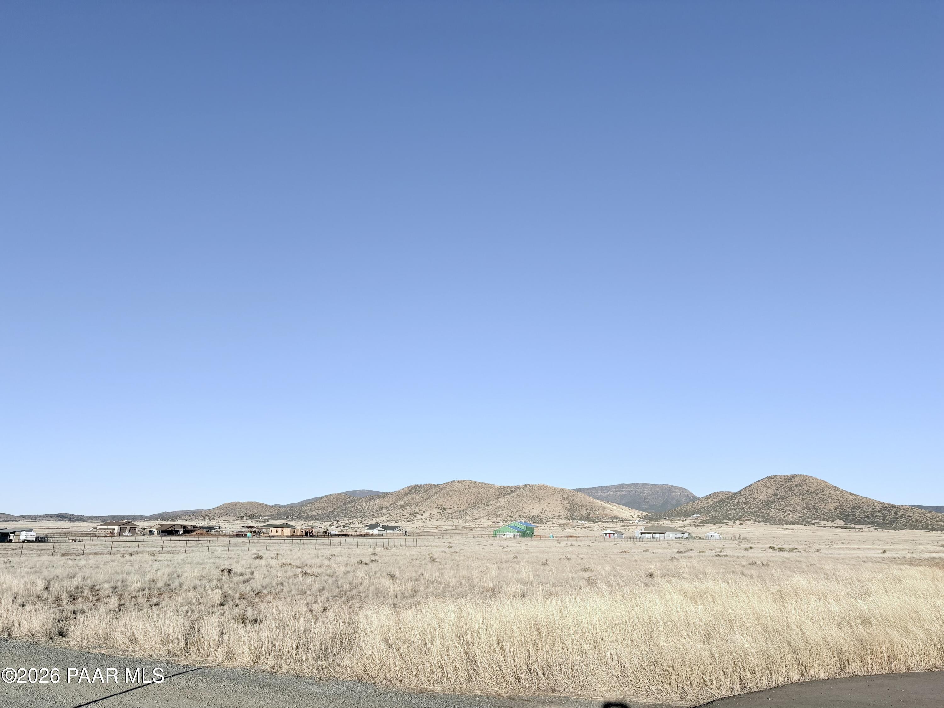 Only a few remaining lot opportunities left to build your dream home in the beautiful Lonesome Valley community in North Prescott Valley. These 4.02 acres can be purchased altogether at this featured price or the two 2.01 acres lots are each listed separately for $108,000. These premium North backyard facing flat lots are easy to build on, are right off a paved road for your convenience, are very close to 2,500 wide open acres of Arizona State Trust BLM land and have breathtaking panoramic Mountain and Valley views. You'll enjoy panoramas and direct access to wide-open nature perfect for horseback riding, hiking, ATV riding, or simply soaking in the peace. With mountain vistas in nearly every direction, these lots are in an ideal setting for your dream home, barndominium, or ranchette retreat. Bring your vision to this peaceful, quiet setting, all while being just a short drive from medical, schools, shopping, entertainment, restaurants and amenities that make Prescott Valley such a desirable place to live! Don't miss this rare chance to own and create your ideal property in one of the area's most tranquil and scenic locations! Parcel #'s included in this sale are 401-01-166R and 401-01-166T.