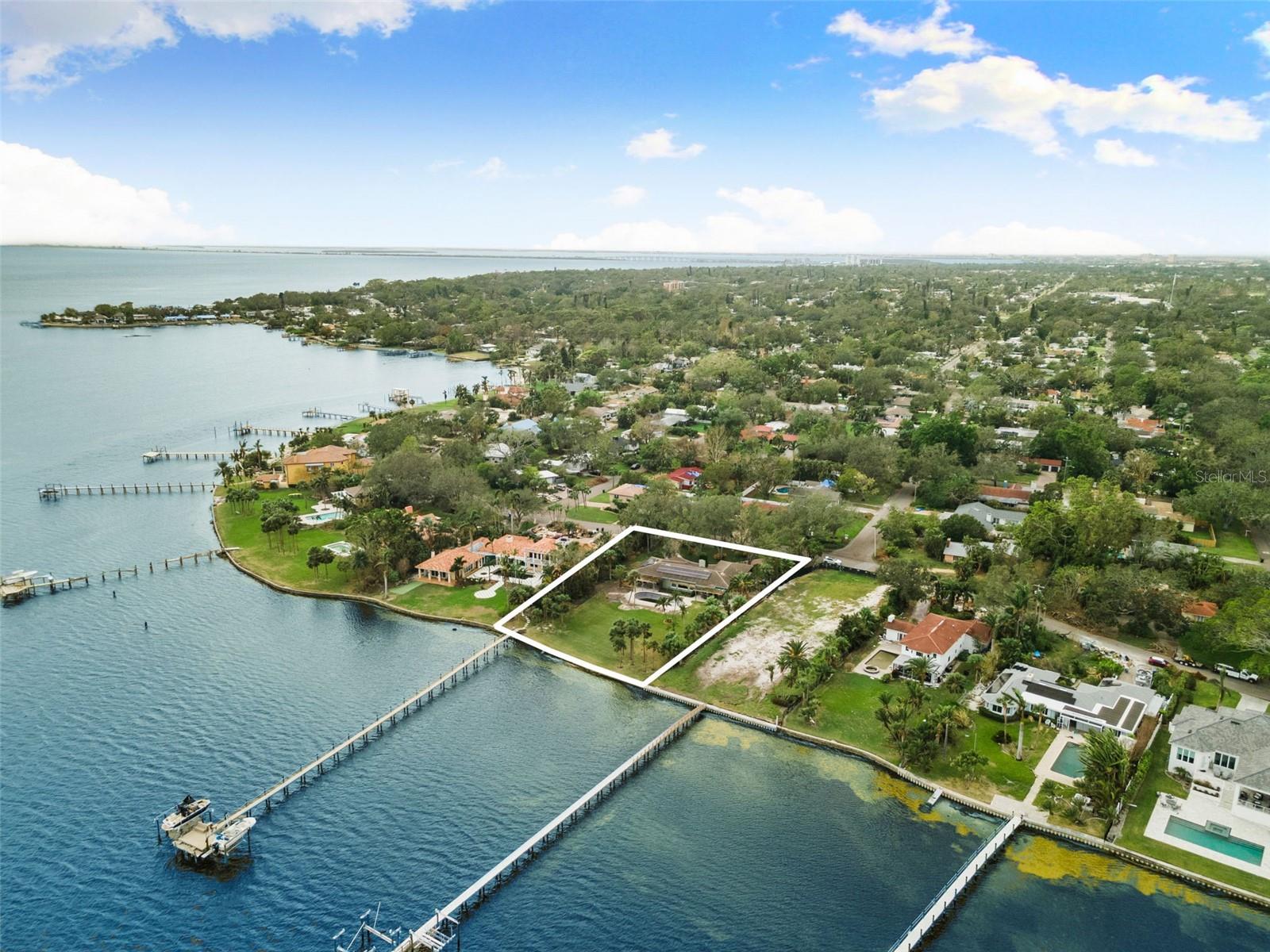 Welcome to Bahama Shores Waterfront neighborhood. Here is your chance to build your luxury dream home on one of the most coveted and largest waterfront lots in St. Petersburg! This  property is a .76-acre lot, 138-by-270 feet, which looks out to direct open water paradise views, with dolphins and manatees frequently passing by. The backyard oasis is an excellent space for entertaining or creating a majestic garden. The backyard is also where you can enjoy the most breathtaking sunrises. This property is also ideal for those who are boating enthusiasts with a love of the outdoors. This property includes a shared dock with a personal boat lift. The navigable channel provides access to downtown St. Pete or visit the Gulf of Mexico islands just minutes away. The charming Bahama Shores neighborhood is just minutes from downtown St. Petersburg, which hosts many great restaurants, museums and waterfront parks. Just a 15-minute drive to the beaches and 30 minutes to Tampa International Airport. **On the property is a 1959 block-constructed 2,856-square-foot home with four bedrooms, three baths, a tile roof in 2004, solar panels in 2019 and new a/c. Professional photos of the inside are available upon request. Home and pool will need a full remodel**