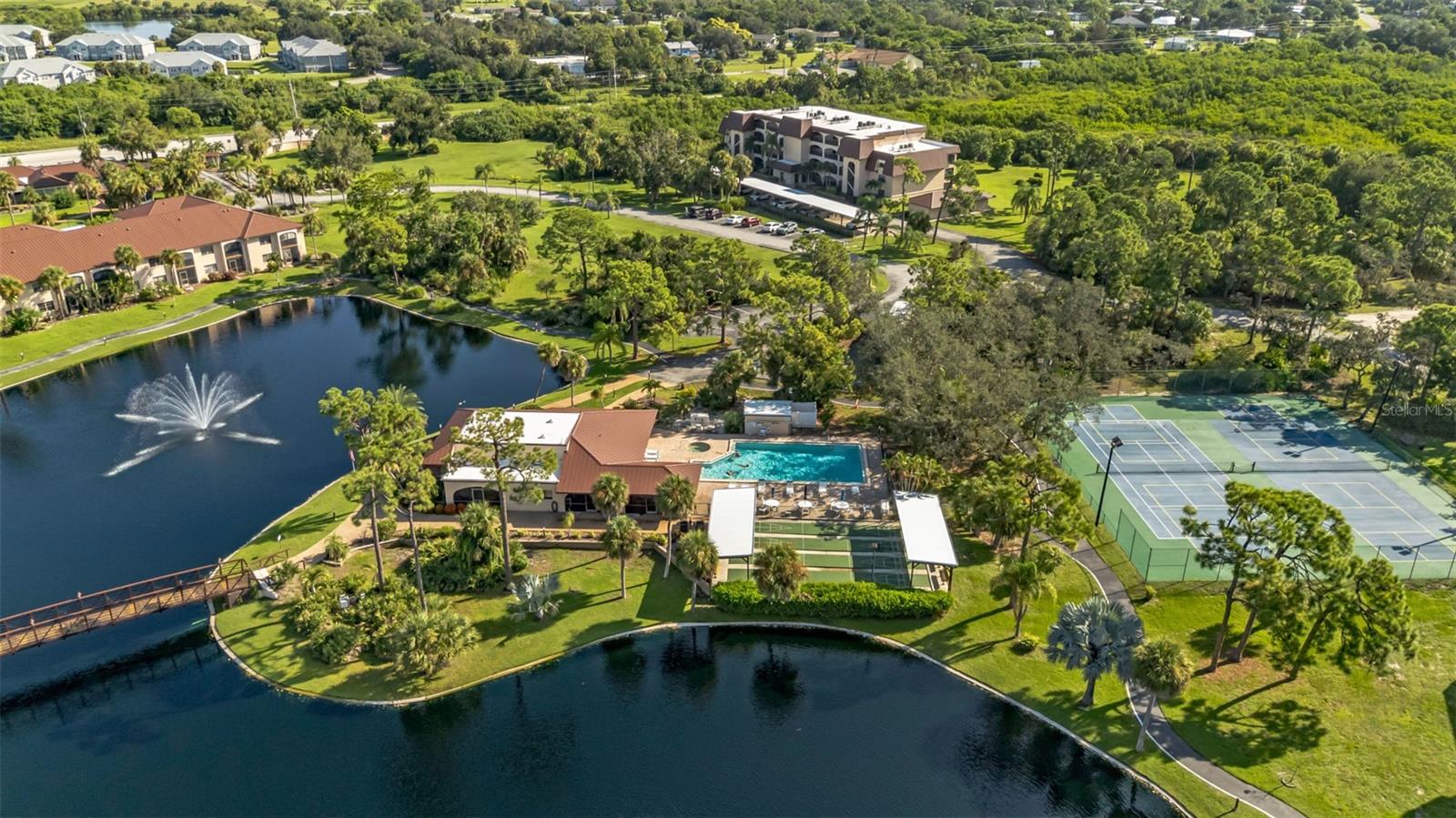FURNISHED and MOVE-IN READY! Looking for your slice of southwest Florida fun in the sun? Welcome to Rolls Landing, a gated 40-acre waterfront community on the Peace River offering the perfect mix of natural beauty, resort-style amenities, and a prime Port Charlotte location. 
This spacious 2-bedroom, 2-bath second -floor condo enjoys serene preserve views and easy access to all the community amenities. Inside, the open layout features tile, laminate wood (2021) and new carpet flooring (2021), stainless appliances in the kitchen, a breakfast bar, a dining area large enough for a full dinner party, full size stack washer and dryer in unit, and plenty of storage inside Plus more in the included storage room downstairs. New hot water heater (2024) and new 2.5ton AC (2024) ensure comfort. The living room opens through sliding glass doors to a screened lanai with relaxing views of the preserve area to the east of the community. The preserve to the east of the community is owned by the association and there are no plans to build any more buildings, so your view is preserved. The primary suite offers a walk-in closet, and a private bath with walk-in shower. Covered parking is included, plus guest parking is available. 
Rolls Landing offers an unmatched lifestyle: heated pool and spa, tennis and pickleball courts, shuffleboard, bocce ball, clubhouse with kitchen, fitness center, library, and year-round social activities. There’s even a pickleball league! Outdoor enthusiasts will love the nature trails, kayak launch, boat trailer parking, car washing station, and fishing pier that extends into the Peace River (being rebuilt in 2026!). First-come, first-serve boat slips provide direct access to Charlotte Harbor and the Gulf of Mexico. When you reserve a slip space for a small fee you can also opt to have a boat lift (see association for details and current prices). Boat and RV storage is available On-Site for a small fee. Basic Cable/Internet, Sewer, Water and Trash are all included in your monthly fees making this easy living! All assessments have been paid and this condo sustained no interior damage from recent storms. The community has replaced roofs and carports and the fishing pier and boat slips are next for reconstruction.  
The location is unbeatable—just minutes from Downtown Punta Gorda, Fishermen’s Village, the Sunseeker Resort, US-41, I-75, Punta Gorda Airport, shopping, dining, golf, and Gulf beaches.
Enjoy maintenance-free living in one of Punta Gorda’s most desirable waterfront communities. Don’t miss this opportunity to make Rolls Landing your new Florida retreat. Schedule your private showing today!