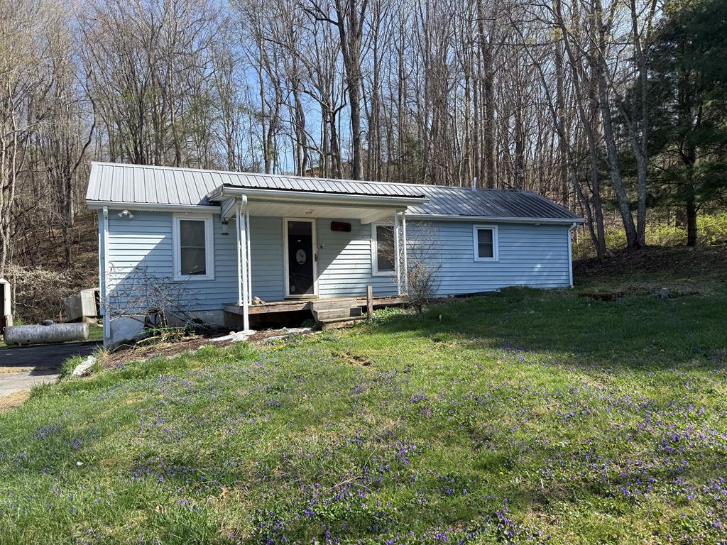This 3 bedroom 1 bathroom home is located on over one acre. Near wooded hills and bubbling creeks this property has so much potential with it's extra large lot, metal roof, and beautiful hard wood floors. It's a blank slate for the next home owner, investor, or flipper. The sheds convey. buyer/buyer agent to verify all information contained here in is accurate.