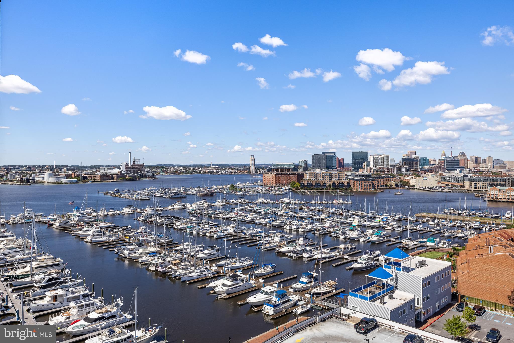 Welcome to Unit 1206 at Anchorage Towers, a luxury high-rise on Canton’s Waterfront Promenade! This 2-bedroom, 2-bath condo offers breathtaking harbor views, two secured garage parking spaces, and 24-hour front desk service. Inside, enjoy an open kitchen/living/dining layout with a spacious island, pantry, and under-cabinet lighting. Two sliding Anderson doors lead to a large west-facing balcony—perfect for soaking in sunsets. The flexible living space easily accommodates dining, entertaining, and even a home office or indoor garden. The primary suite features a walk-in shower and double vanity, while the guest bedroom overlooks Canton and Patterson Park. Both the living room and primary bedroom include in-ceiling Bose speakers. Anchorage Towers residents enjoy a fitness center, community room, deeded storage, and a secured bike room. Conveniently located across from Safeway and steps from shops, restaurants, and waterfront parks—with quick access to I-95, city transit, and the water taxi. Don’t miss this opportunity to own a beautiful waterfront oasis in the heart of Baltimore!