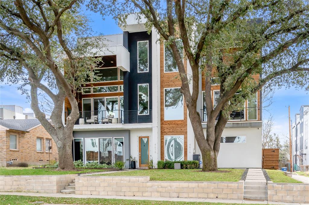 Welcome home to this stunning 3-story townhome in the heart of Dallas! This 3 bed, 3.5 bath residence offers a smart split-bedroom layout with secondary bedrooms on the first floor and a private primary suite on the second. The chef’s kitchen is a true showstopper, featuring stainless steel appliances, a double oven, gas range, chef’s refrigerator, and ample space for cooking and gathering. Hardwood floors highlight the main living areas, and bedrooms, and tile or luxury vinyl in the baths. Decorative lighting adds style throughout.The primary bath features dual sinks and a Hollywood-style tub and dual shower heads for a spa-like feel. Enjoy a side yard plus a spacious third-floor covered patio—perfect for entertaining! Additional features include a tankless water heater, attached garage with epoxy floors and tesla charger, and washer, dryer, and refrigerator conveying with the sale. Located near shops, dining, and major Hwy 75, this home offers luxury and convenience in one incredible package!