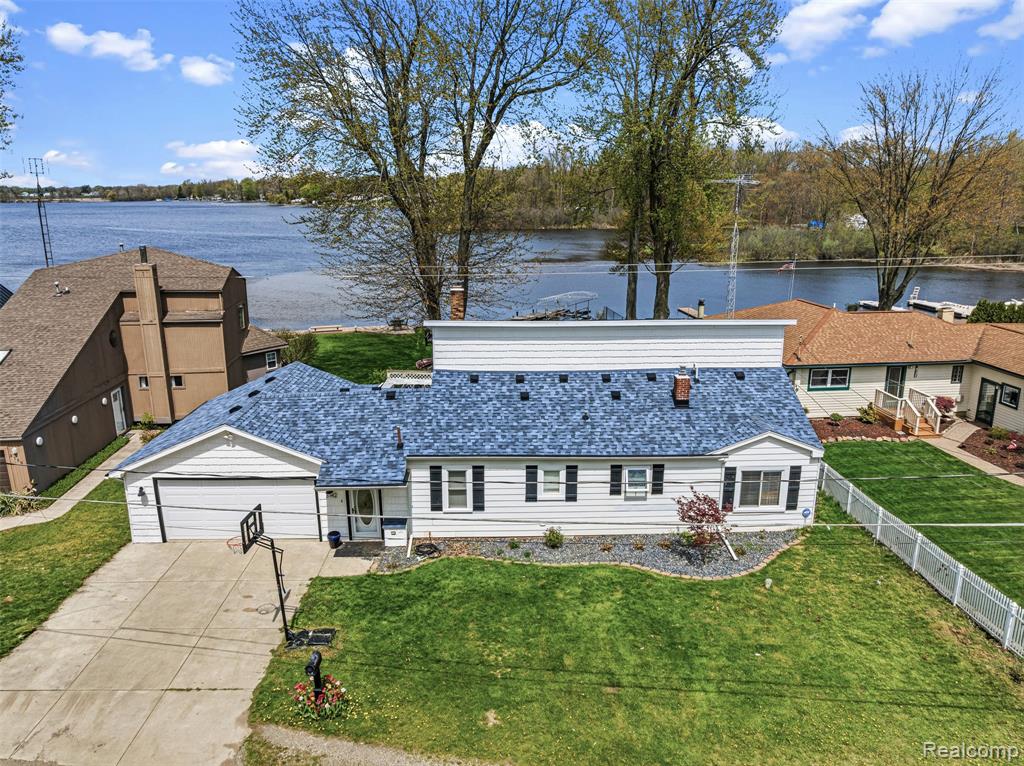 Million-Dollar Views on All-Sports Lake Ponemah!This stunning 3-bedroom, 3-bathroom lakefront home has everything you've been looking for. Enjoy breathtaking lake views from your huge deck, relax in the 3-seasons room with a hot tub, or cozy up by the brick fireplace inside. The spacious floor plan features a large primary bedroom and an attached 2-car garage.Lake Ponemah connects to Squaw and Tupper Lakes, offering endless fun — boating, jet skiing, fishing, and more — right outside your door. Minutes from downtown Fenton.Lakefront opportunities like this don't last. Come see it before it's gone!