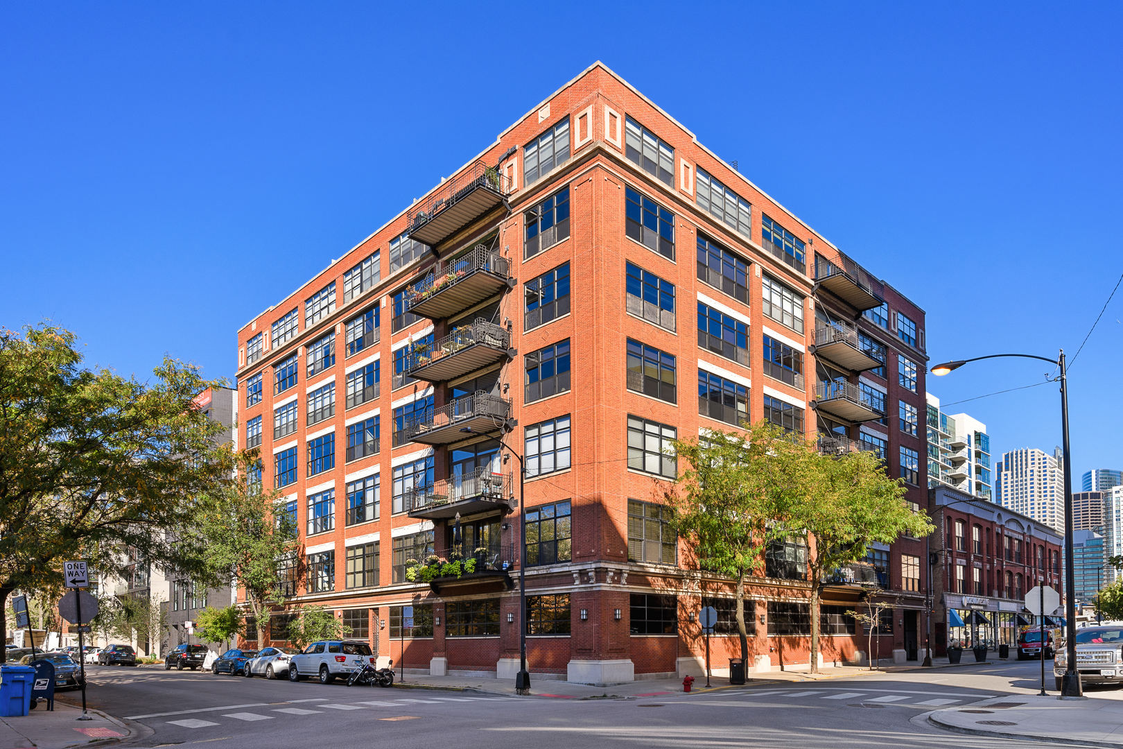 Introducing a breathtaking West Loop Penthouse overlooking Mary Bartelme Park: a two-story loft offering the ultimate blend of luxury, design, and functionality. With over 3,400 sq ft of beautifully renovated living space and more than 1,000 sq ft of private outdoor retreats, this Southwest Corner Penthouse will wow you with the park and city views. The home features the ultimate West Loop loft living, and showcases soaring ceilings, abundant natural light, and curated details at every turn, from Florense cabinetry and custom millwork to Control4 smart home technology. The show-stopping Chef's kitchen is both sleek and functional, featuring Sub-Zero, Asko and Wolf appliances with a double oven and warming drawer. Additional luxuries include a Grohe Blue faucet for instant carbonated water and filtered water system, plus beverage drawers so you never run out of storage. The massive island with seating and storage is perfect for entertaining and enjoying, and the modern pendants highlight the craftsmanship of the home. Perfect for entertaining, the kitchen flows seamlessly into expansive living and dining areas that open to a balcony overlooking Mary Bartelme Park. The oversized primary suite features wonderful closet space, a dressing area, and an ensuite bath that feels like hotel living. You will enjoy a steam shower, a separate soaking tub, and dual vanities.  A guest bedroom and second bath complete the main floor, while a polished terrazzo staircase with custom steel rails leads to the upper level, where a flexible media room/den, office/guest room, and access to a remarkable private roof deck await. With panoramic South East, and West views, the outdoor roof deck features city skyline as well as park views. The rooftop is a true retreat, complete with a custom outdoor kitchen featuring steel cabinetry and a concrete countertop. Ideally located in the heart of the West Loop, you'll enjoy world-class dining, boutique fitness studios, and great shopping just outside your door. This is an incredible opportunity to own a piece of the West Loop.