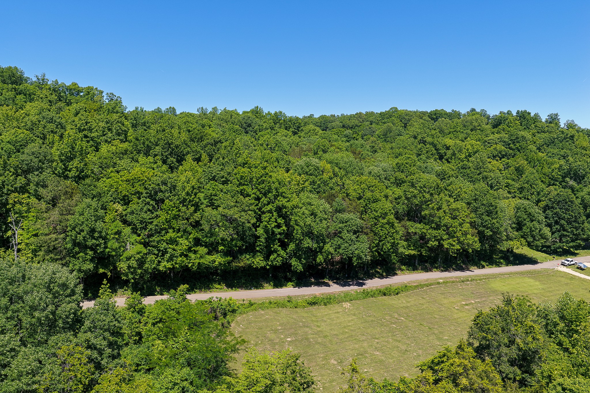 Welcome to the Mayberry Prong Tract, a sprawling 969-acre property in Linden, Tennessee. This magnificent property in Perry County offers a rare blend of recreational bliss and timberland potential. Whether you envision a private hunting retreat, a serene escape, or a strategic investment in undeveloped land, this tract promises an opportunity to craft your ideal retreat amidst heavily wooded landscapes and a vibrant ecosystem. Nestled in the charming city of Linden, Tennessee, this expansive tract benefits from the tranquil ambiance of Perry County. Its strategic placement offers both seclusion and accessibility, providing a peaceful escape while remaining connected to local conveniences. The region is renowned for its natural beauty and outdoor recreational opportunities, making it an ideal setting for a property of this caliber.The Mayberry Prong Tract presents a diverse and captivating landscape, characterized by its heavily wooded nature and natural state. The terrain features a blend of clay and gravel soils, offering a robust foundation for various uses and a rich environment for the abundant vegetation. This varied topography creates a canvas for exploration and development, inviting a multitude of possibilities.Access to this remarkable property is well-established via county road frontage, featuring dirt and gravel road types that ensure convenient entry. This direct access facilitates easy navigation throughout the tract and connects it seamlessly to the surrounding areas, making it readily accessible for all your endeavors.This tract currently has a Conservation Easement on it with Foothills Land Conservancy. This ensures that the legacy and integrity of the land stays intact for years to come. More information on the conservation easement can be provided upon request.
