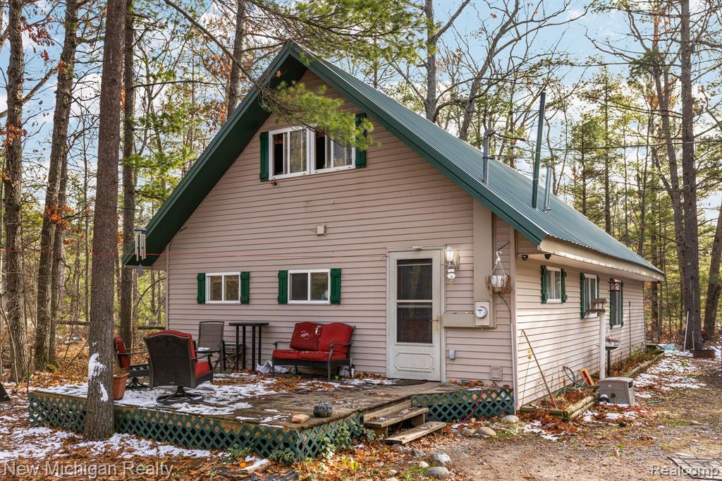 Charming A-Frame Retreat on 5 Acres in Lewiston, MI.  Nestled on 5 picturesque acres, this charming A-frame home was beautifully remodeled in 2003. The property features 1 cozy bedroom and a loft upstairs, perfect for additional sleeping space or a home office. The open-concept living room, kitchen, and dining area offer a warm, inviting atmosphere. You’ll also find a convenient laundry area. Plus, a spacious 20x30 pole barn is perfect for storage or hobbies.Don’t miss out on this serene getaway in the heart of Lewiston!