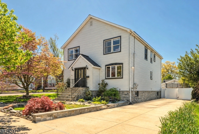 Welcome to this spacious 4 bedroom, 4 bath Colonial ideally situated in a desirable Lyndhurst location. Featuring beautiful hardwood floors and an open concept layout, this home is designed for both comfortable everyday living and effortless entertaining. A welcoming foyer opens to a formal dining room and formal living area, leading into a cozy TV room and convenient powder room. The modern eat-in kitchen is the heart of the home, complete with a center island offering seating for three and sliders that open directly to the backyard creating seamless indoor outdoor living. Upstairs, the primary suite features a walk-in closet and private ensuite bath. Three additional well sized bedrooms and a full hall bath complete the second level. The partially finished basement offers additional flexible living space with access to the outdoor entertaining area. Enjoy a private backyard oasis featuring a patio with a built in grill and a heated saltwater in-ground pool perfect for summer gatherings. Additional highlights include a spacious two car garage and a prime location close to NYC transportation, major highways, shopping, and schools.