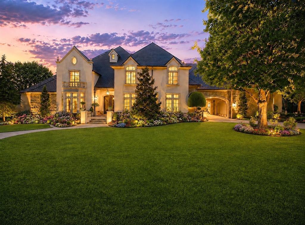 A home with championship pedigree, this exceptional European-transitional estate is situated on a beautifully landscaped 2/3 acre lot in prestigious Ashton Grove, Norman’s premier gated community. Backing to permanent green space, the property offers a rare combination of privacy, luxury, and resort-style living.  Designed for both entertaining and everyday comfort, the nearly 6,000-square-foot floor plan features soaring ceilings, abundant natural light, multiple living areas, a vaulted study, and a beautifully updated gourmet kitchen with a full Viking appliance suite.  The luxurious primary retreat includes a fireplace, spa-inspired bath, and direct access to the backyard oasis. A secondary downstairs suite provides ideal guest accommodations, while three additional bedrooms and a spacious game/media room are located upstairs. Recent improvements include a DaVinci roof, three new HVAC systems, refreshed exterior finishes, refinished pool surfaces, fresh paint, updated lighting, and numerous enhancements throughout. The private backyard showcases an infinity-edge pool and spa, expansive outdoor living areas, mature landscaping, and a cabana complete with a fireplace, grill, and television. Two 2-car garages are oversized and there is a huge gated courtyard in between for additional parking or just for fun...makes a great basketball court! Only minutes from the University of Oklahoma, shopping, dining, and entertainment, this extraordinary Ashton Grove estate offers timeless elegance, modern comfort, and incredible views!