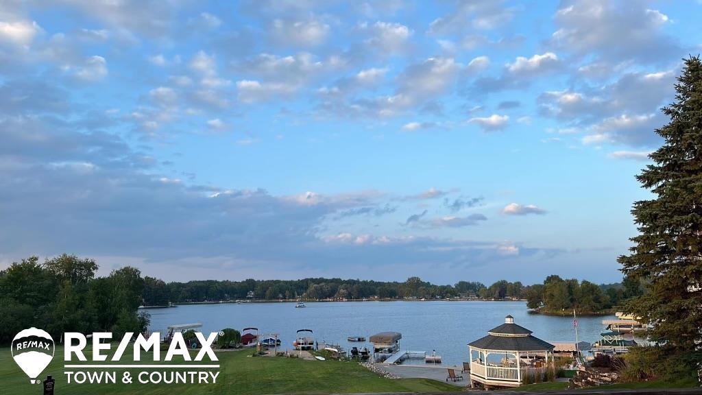 If You don't want large bedrooms, modern updates or a big yard, this isnt the house for you  But if you like room for everyone and room to play, come check out this beauty on Lake Lancer in Sugar Springs.  Welcome home with over 4,000 sq ft of beautifully designed living space sitting on .60 acres with 70 ft of frontage on Lake Lancer in the heart of Sugar Springs. This stunning 4 bedroom 3 full bath home delivers space, comfort, and panoramic water views from nearly every main living area. Whether you're starting your day with a coffee or hosting a weekend getaway, the scenery never disappoints. This home has so much to offer. Come relax in your living room, family room, sunroom, 2 kitchens, a separate dining room/office/bonus, large bedrooms and so much more. Buy today and enjoy all the seasons with your family making memories on the water. If you think the walk to the lake is long get a golf cart and make it easy. Located in the sought after Sugar Springs community, you'll have access to top tier amenities: a clubhouse, 18 hole golf course, pool, restaurant, private beaches, fitness center and so much more. https://sugarsprings.net/ Whether you're searching for a full time residence or the ultimate getaway this Lake Lancer gem checks every box.