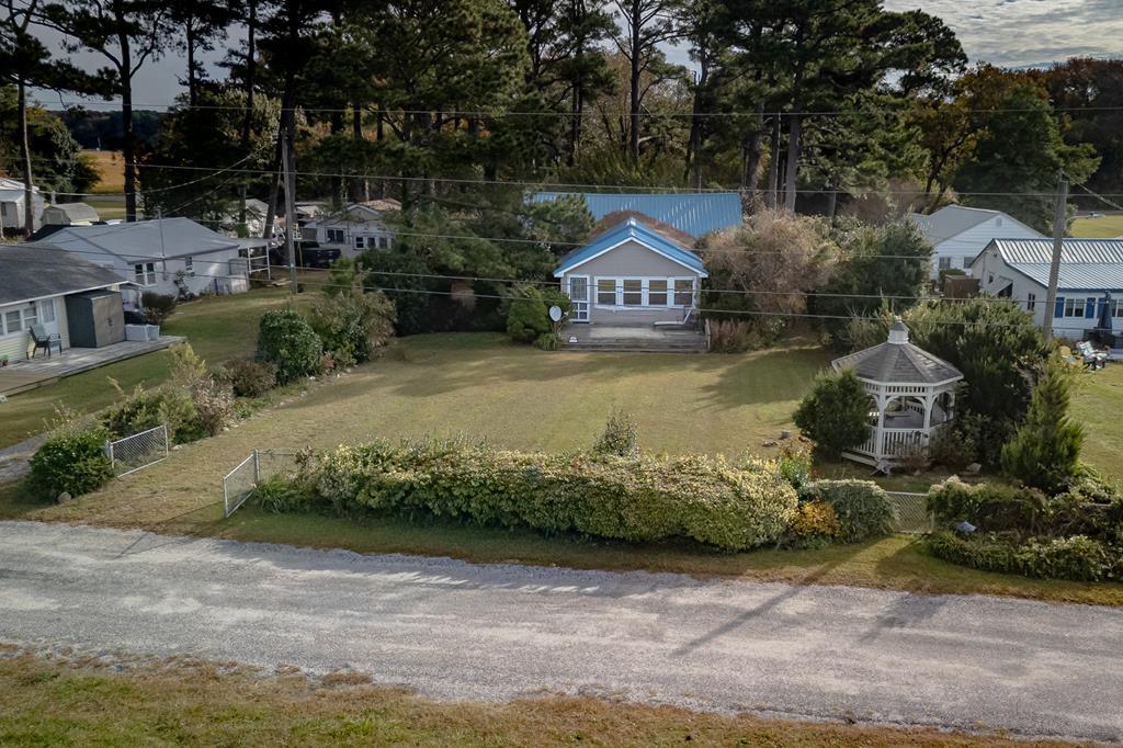 Welcome to the community of Silver Beach! Families from near and far have enjoyed making memories here for many years. I also remember making my own memories. Some will remember Lill's and just around the corner filling your pockets with the best candy ever at Johnny Drummonds. This property offers over 1500 sq. ft.+- and is situated on 0.42 ac lot. Enclosed front porch with amazing Chesapeake Bay views. Spacious rooms to bring the whole family for your vacation getaway any time of year. The yard has plenty of space for your outdoor activities and filled with lovely plantings. Shed & one car garage for all of the extra items.  Private beach access for property owners and guest. 5 mi. to boat ramp. Home sold "AS IS" Inspections at buyer's expense for informational purpose only. No dock.