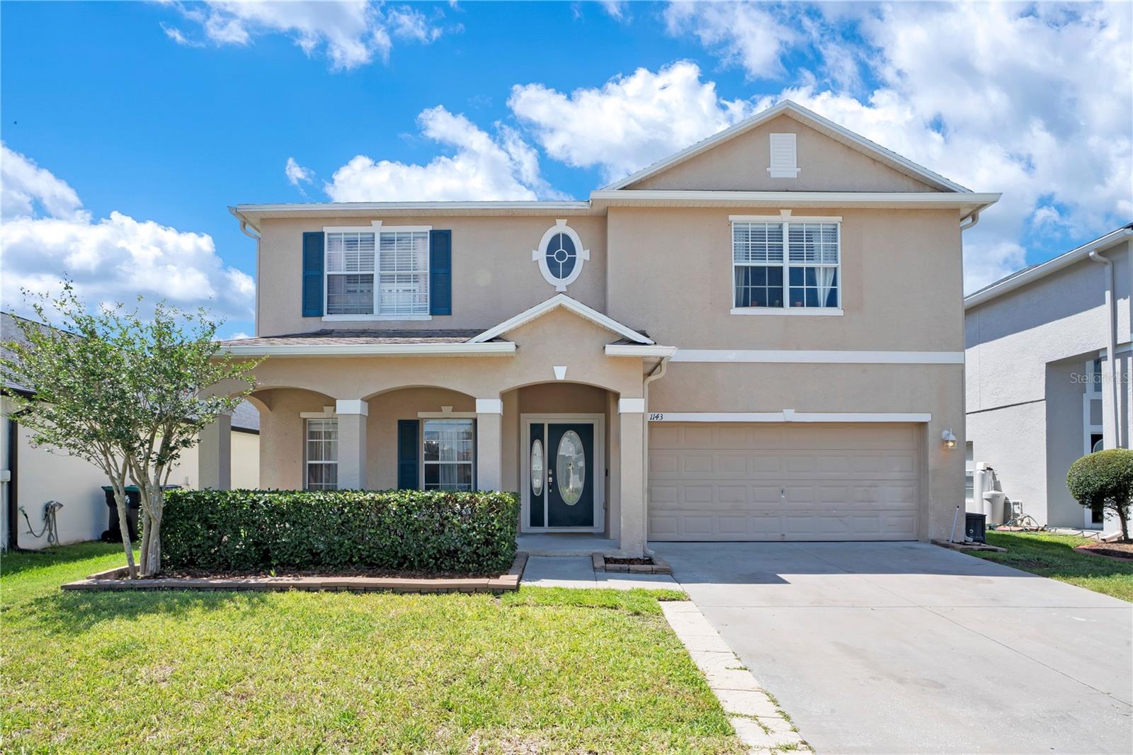 This stunning, and spacious 6-bedroom, 3-bathroom home is situated in the digitally gated Avalon Lakes community. Upon entry, you’re welcomed by a versatile formal living space featuring custom built-in shelving with lighting, perfect for displaying décor, books, or personal achievements. This flexible area can also serve as a home office, game room, or additional entertaining space. This stunning property features a modern kitchen with a farmhouse sink, quartz countertops, 42-inch cabinets, and an open-concept layout enhanced by high ceilings and porcelain wood-look tile throughout the first floor. The family room flows seamlessly from the kitchen and features French doors that open to a large, fenced backyard with a spacious covered patio and , ideal for outdoor living and gatherings. Or step into your private backyard retreat featuring a beautiful gazebo, ideal for hosting get togethers, outdoor dining, or unwinding in a peaceful, shaded setting. A convenient first-floor bedroom and full bathroom provide excellent flexibility for guests or multigenerational living. Upstairs, you’ll find the remaining bedrooms, including the expansive primary suite, a Jack-and-Jill bathroom, and a dedicated laundry room. All bedrooms feature newer carpet and are easily maintained with a central vacuum system, which also extends to garage use, perfect for keeping your car clean. Enjoy living in a vibrant community with tree-lined streets, scenic lakes, top-rated schools, and resort-style amenities. The HOA includes access to a community pool, playgrounds, parks, basketball and tennis courts, a baseball field, and a fitness center. Conveniently located just minutes from UCF, Waterford Lakes Town Center, Lockheed Martin, major highways (528, 417, 408), and Medical City—this home truly has it all!