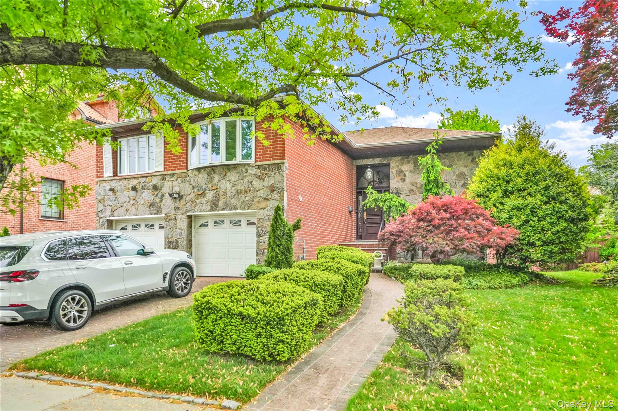 Exceptional 4-Bedroom Home in Exclusive Malba on XL 60 x 115 FT LOT – Two Kitchens, 2-Car Garage & Expansive Private BackyardWelcome to this beautifully maintained 4-bedroom, 3-bathroom home nestled in the heart of Malba, Whitestone—one of Queens’ most prestigious and sought-after waterfront neighborhoods, celebrated for its quiet tree-lined streets, elegant homes, privacy, and strong sense of community.Perfectly situated just moments from Powell’s Cove Park and the waterfront, this exceptional residence offers the rare opportunity to enjoy peaceful waterfront strolls, stunning sunsets, and the serene charm that makes Malba one of New York City’s true hidden gems.Thoughtfully designed for both comfort and versatility, this home features two full kitchens—one on each level—making it ideal for extended family, multi-generational living, guest accommodations, or flexible everyday living. Spacious living and dining areas on both floors are filled with natural light, creating a warm, inviting atmosphere and a functional layout designed for both entertaining and privacy.Step outside to your oversized private backyard—an impressive outdoor retreat perfect for hosting gatherings, relaxing in complete privacy, gardening, or creating your own custom outdoor oasis. The property also offers a private driveway, a two-car garage, and sits on a generously sized lot with excellent curb appeal and timeless neighborhood charm.Property Highlights:* 60 x 115 Ft Lot Size* 4 spacious bedrooms with excellent closet space* 3 full, beautifully finished bathrooms* Two full kitchens ideal for flexible living and entertaining* Bright, spacious living and dining areas across both levels* Private driveway and attached 2-car garage* Expansive backyard with outstanding outdoor entertaining potential* Beautifully maintained landscaping and classic Malba characterConveniently located near the Whitestone Bridge, Francis Lewis Park, top-rated schools, shopping, and major transportation, this home offers the perfect balance of peaceful suburban living with seamless access to Manhattan and the surrounding boroughs.Homes like this rarely become available in Malba.Don’t miss this exceptional opportunity to own a truly special home in one of Queens’ most exclusive and desirable neighborhoods.