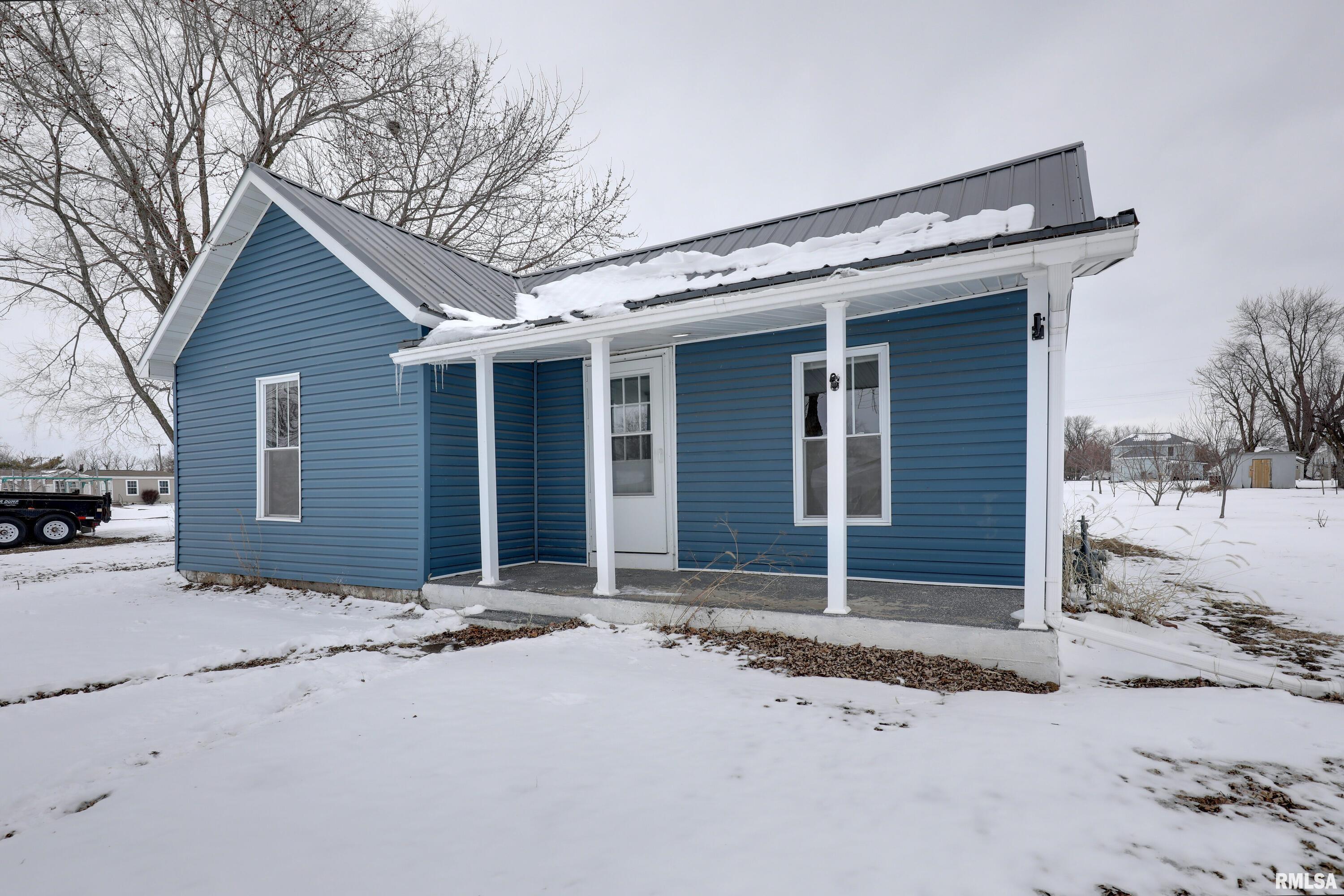 This charming one story home in a sweet small town location has been remodeled from top to bottom over the last fourteen years including a metal roof, siding vinyl replacement windows and more!  With three bedrooms, two full baths and a dedicated laundry/utility room all on one level this home has it all and no basement to worry about.  Located next to the city park this property has a quarter acre lot with alley access which means the possibility to build the garage or outbuilding of your dreams.  The covered front porch is the perfect place to enjoy a summer evening in Coatsburg.  Luxury vinyl plank flooring has been installed throughout the home meaning easy clean up and durability.  The kitchen and both bathrooms were remodeled since 2012 as well.  All that is left is for you to move in!  Call to schedule your showing today!