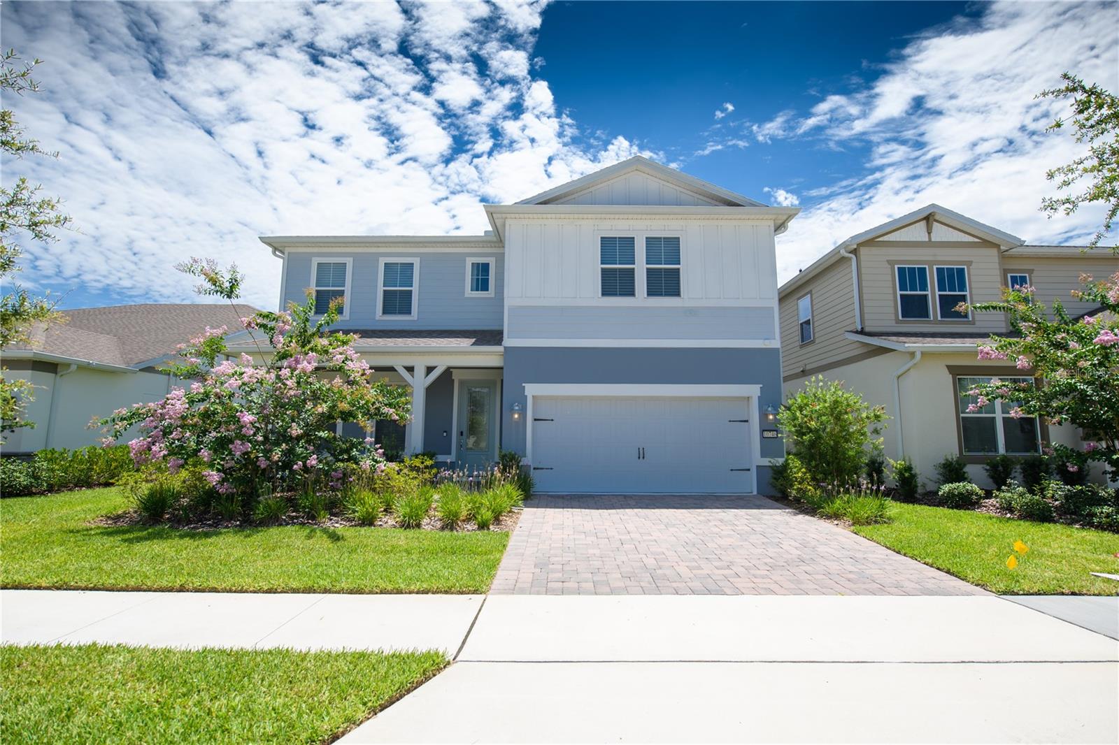 Welcome to this stunning 2024-built two-story residence located in the highly desirable Lake Nona area. Offering 4 bedrooms, 3 full bathrooms, 1 half bathroom, and nearly 2,900 square feet of living space, this thoughtfully designed home combines modern elegance with everyday functionality. The open-concept floor plan features a spacious gathering room, a versatile flex room, an upstairs loft, and a covered lanai, creating the perfect setting for both entertaining and comfortable living. The gourmet kitchen is a chef’s dream, showcasing a large center island, walk-in pantry, quartz countertops, stainless steel appliances, designer backsplash, and abundant cabinet space.The first-floor owner’s suite provides a private retreat with a spa-inspired bathroom featuring dual vanities, a frameless glass shower, and a generous walk-in closet. Upstairs, you’ll find three additional bedrooms, two full bathrooms, and a spacious loft ideal for a media room, home office, or play area. Additional highlights include luxury finishes throughout, upgraded flooring, a dedicated laundry room, a 2-car garage with EV charging capability, and professionally selected designer features. Situated within a gated, resort-style community, residents enjoy access to exceptional amenities including a clubhouse, resort-style pool with splash area, fitness center, playgrounds, and basketball, tennis, and pickleball courts. Conveniently located near Lake Nona Town Center, Medical City, USTA National Campus, major highways, shopping, dining, and Orlando’s world-famous attractions.Experience the perfect blend of luxury, convenience, and the vibrant Lake Nona lifestyle. Schedule your private showing today!