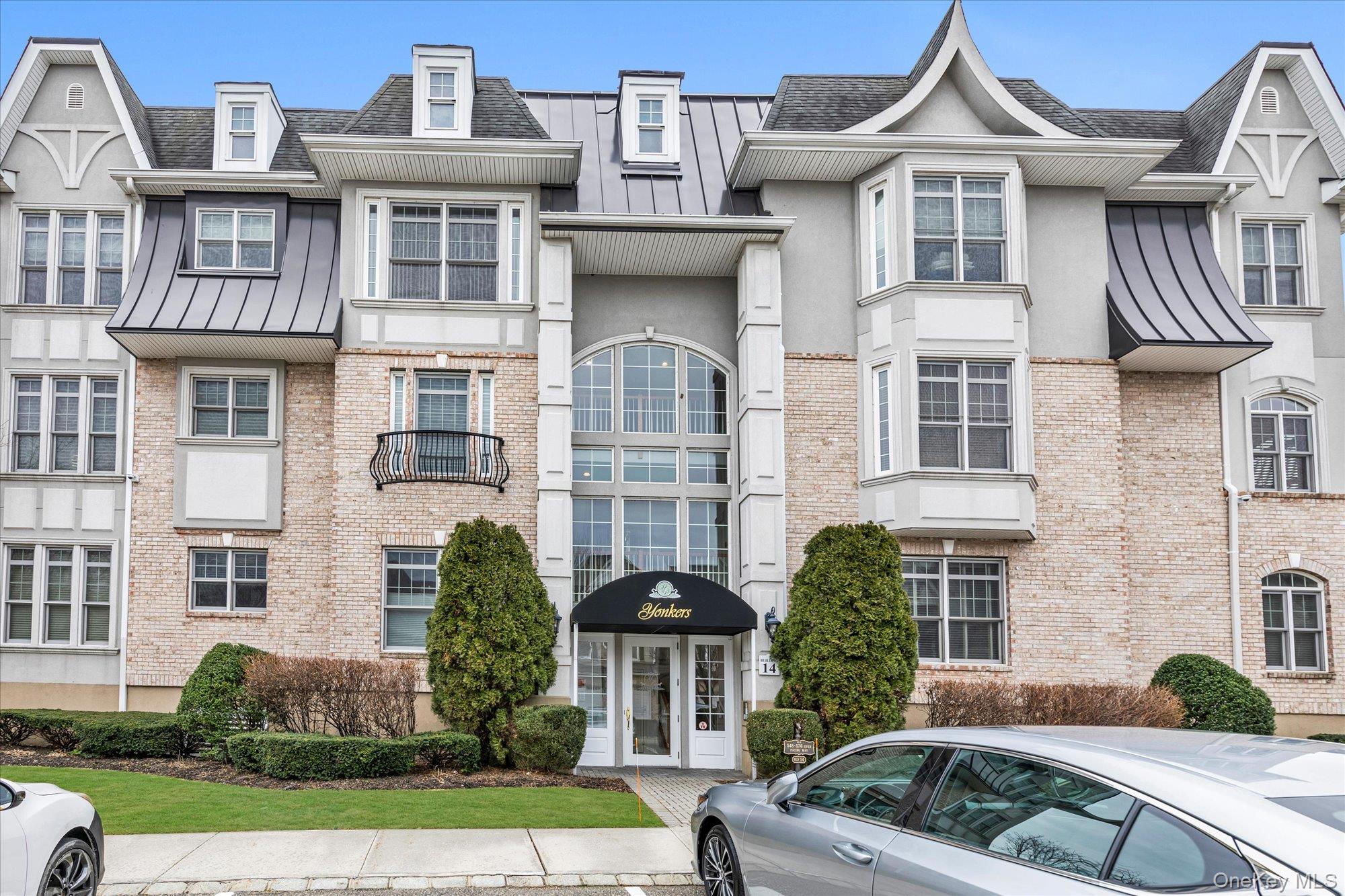 Stunning 2-bedroom, 2-bath, top floor, corner residence in one of Westbury’s most sought-after 55 and over communities. Boasting an exceptional blend of design, comfort, and resort-style amenities, this impeccably maintained home offers all the features discerning buyers are searching for.Step inside to discover an open kitchen equipped with updated stainless steel appliances, perfect for both everyday living and entertaining (especially with the built-in speakers in the ceilings). The spacious layout flows seamlessly to a private balcony, ideal for enjoying your morning coffee or evening sunsets. Tray ceilings add architectural interest and a sense of volume, while two walk-in closets, in the primary bedroom, provide abundant storage space. A private laundry room brings convenience to your daily routine.This home is part of the acclaimed Meadowbrook Pointe Athletic Club & Spa, a resort-style 55+ gated community featuring world-class amenities right at your doorstep. Residents enjoy access to a 25,000-square-foot clubhouse, indoor and outdoor pools, a full fitness center and spa, beauty salon, library, business center, card rooms, a cafe, movie theater, ballroom, tennis, pickleball, bocce ball courts, a full calendar of social activities, discounts from over 80 local shops and restaurants, and much more.Located in the heart of Nassau County, Meadowbrook Pointe offers both tranquility and convenience — close to shopping, dining, and major transportation routes. Pet friendly. This is resort-style living at its finest!